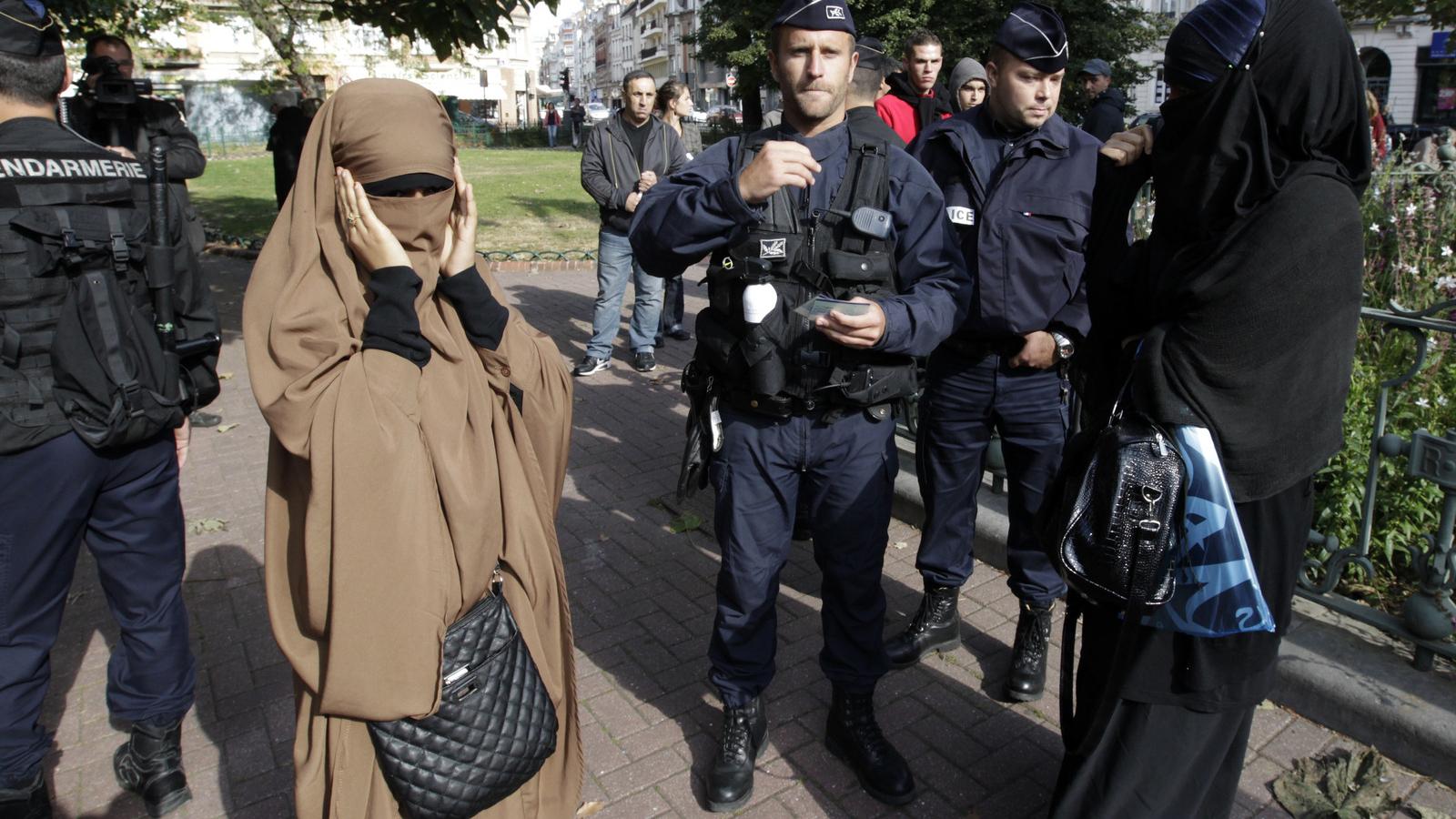 French police check identity cards of two women for wearing full-face veils
