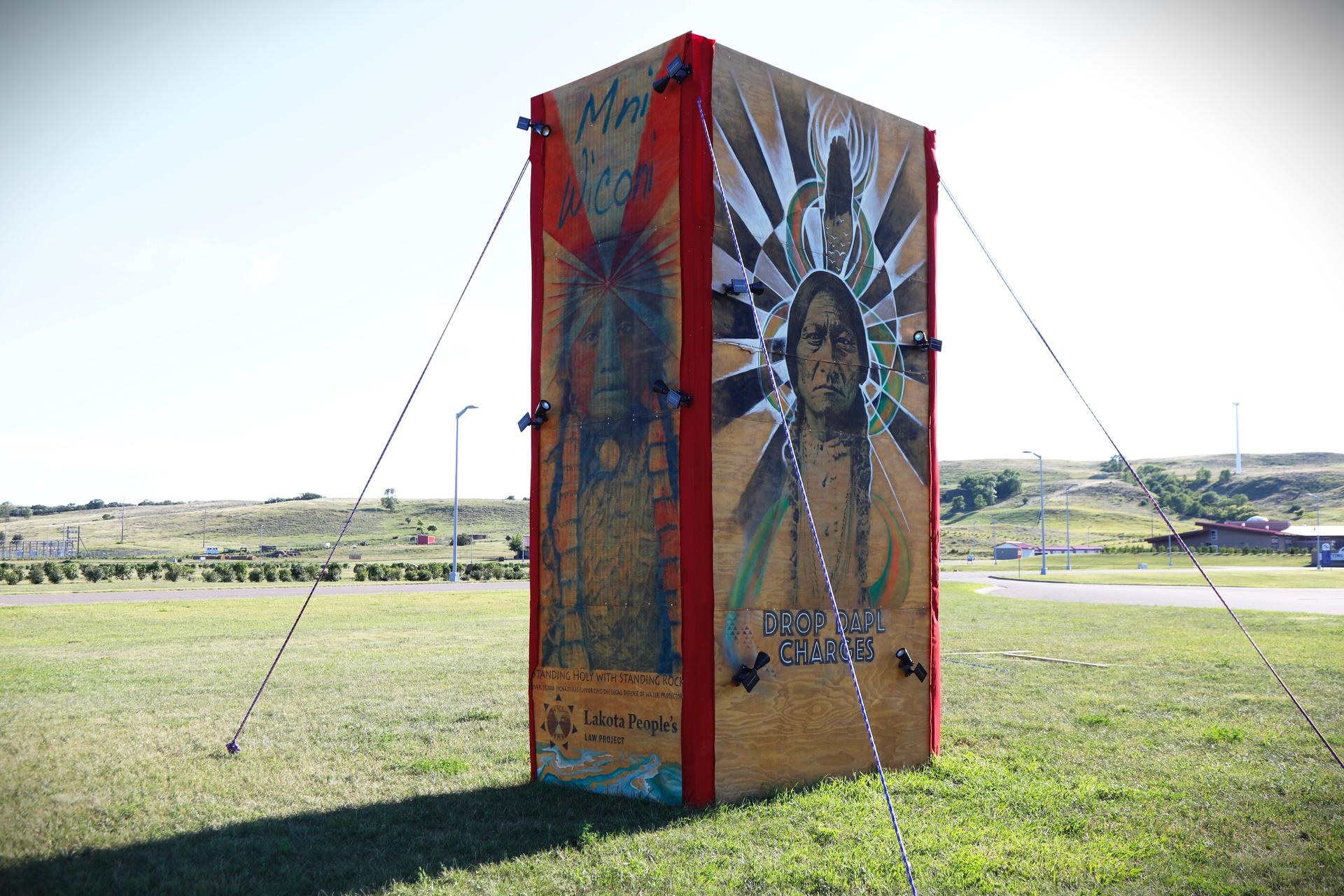 artwork, installed at Sitting Bull College on the Standing Rock reservation, depicts Sitting Bull and his daughter, Standing Holy