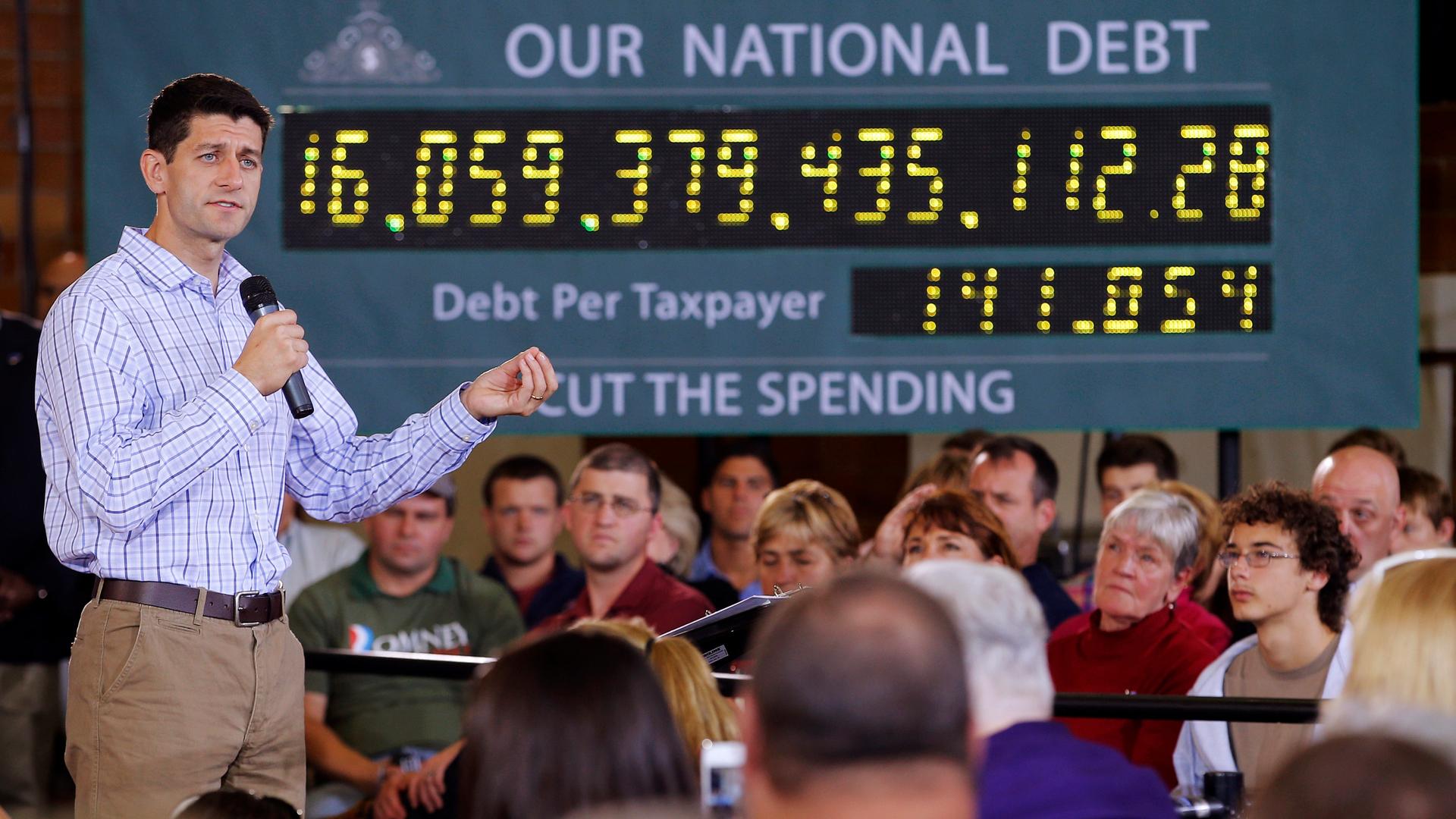 Republican vice-presidential candidate U.S. Congressman Paul Ryan speaking in front of the campaign's "national debt clock" in Dover, New Hampshire September 18, 2012. 