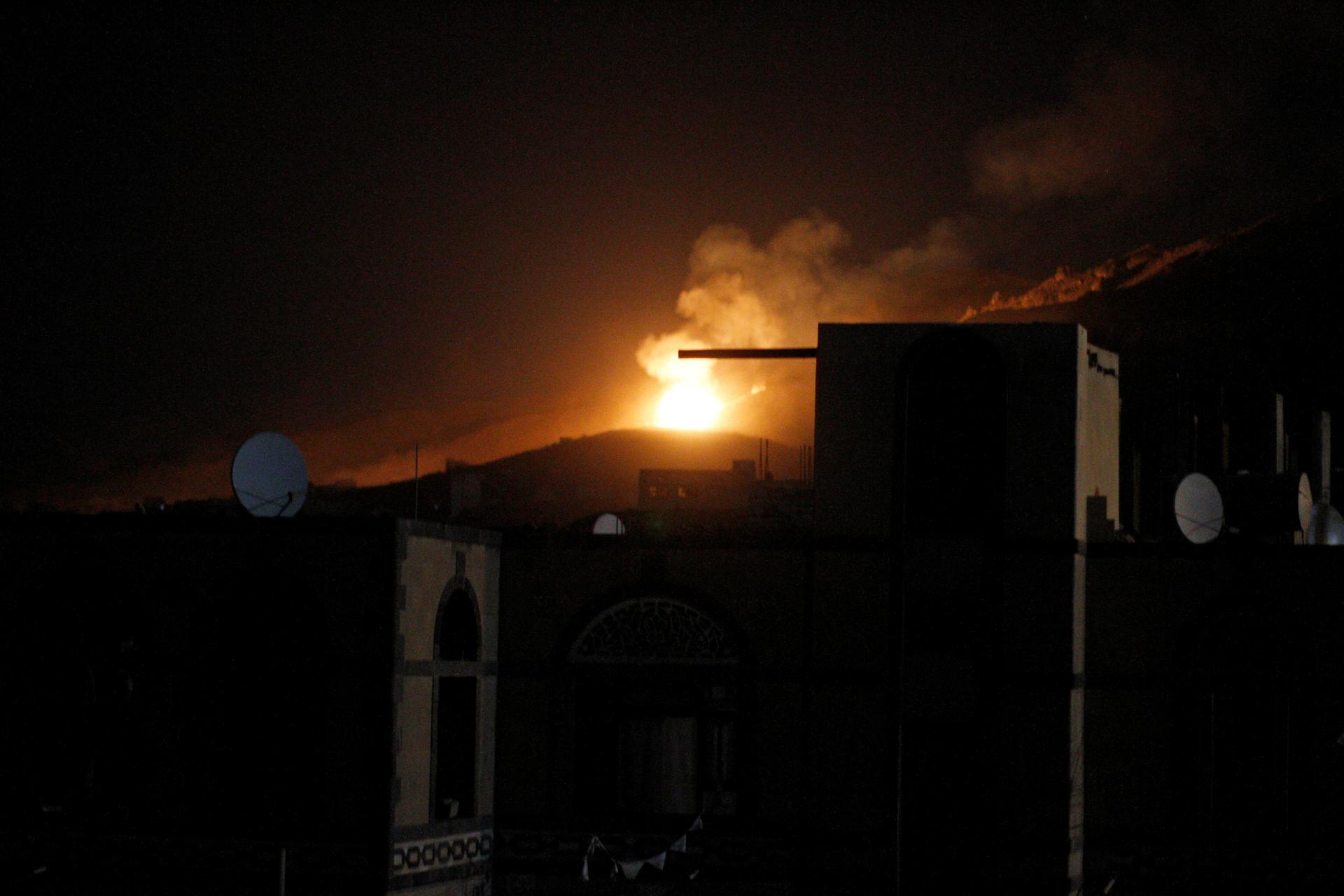 An explosion at a military arms depot is seen after it was hit by a Saudi-led air strike on the Nuqom Mountain overlooking Yemen's capital Sanaa, October 14, 2016.