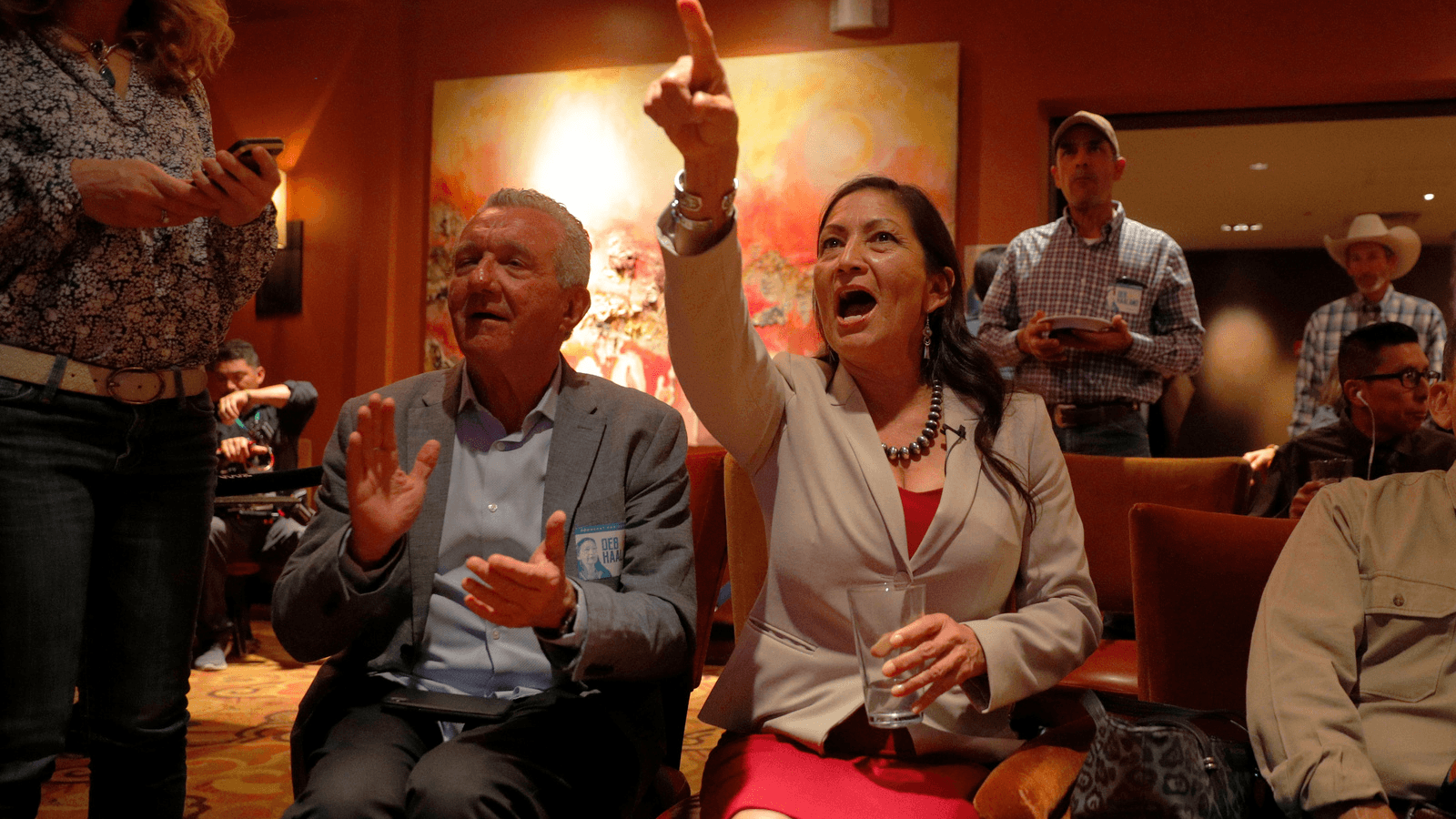 Democratic congressional candidate Deb Haaland reacts upon learning that fellow Native American Sharice Davids of Kansas also won her midterm election