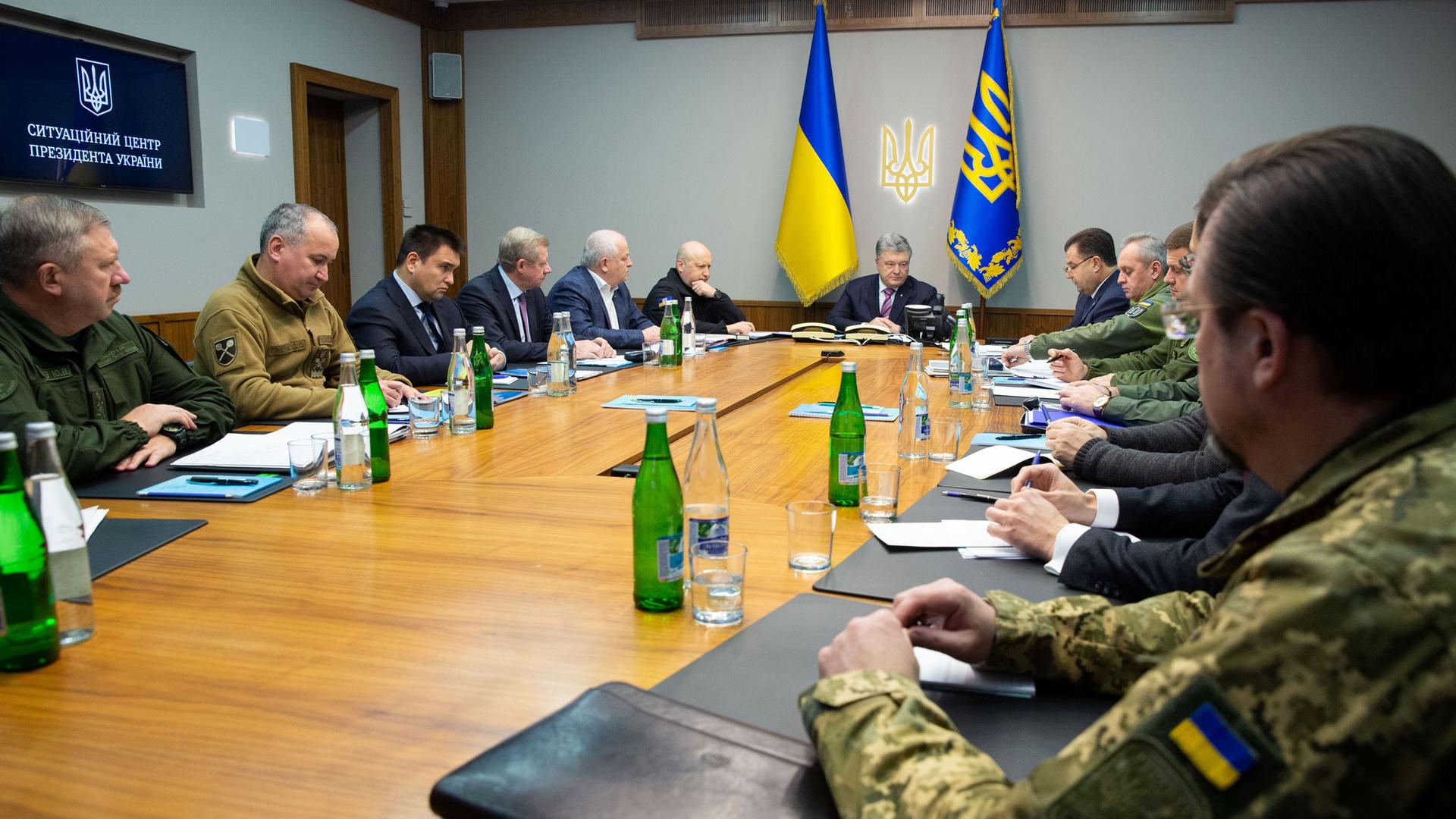Ukrainian President Petro Poroshenko is shown sitting at the end of a table chairing a meeting with heads of military and security forces in Kiev, Ukraine, Nov. 30, 2018.