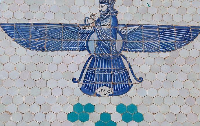 A glazed blue tile depiction of Zoroastrian god Ahura Mazda with blue wings.