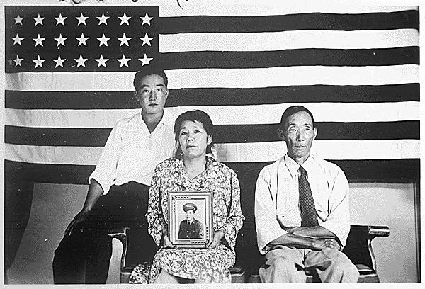 The Hirano family, left to right, George, Hisa, and Yasbei. Colorado River Relocation Center, Poston, Arizona, 1942 - 1945.