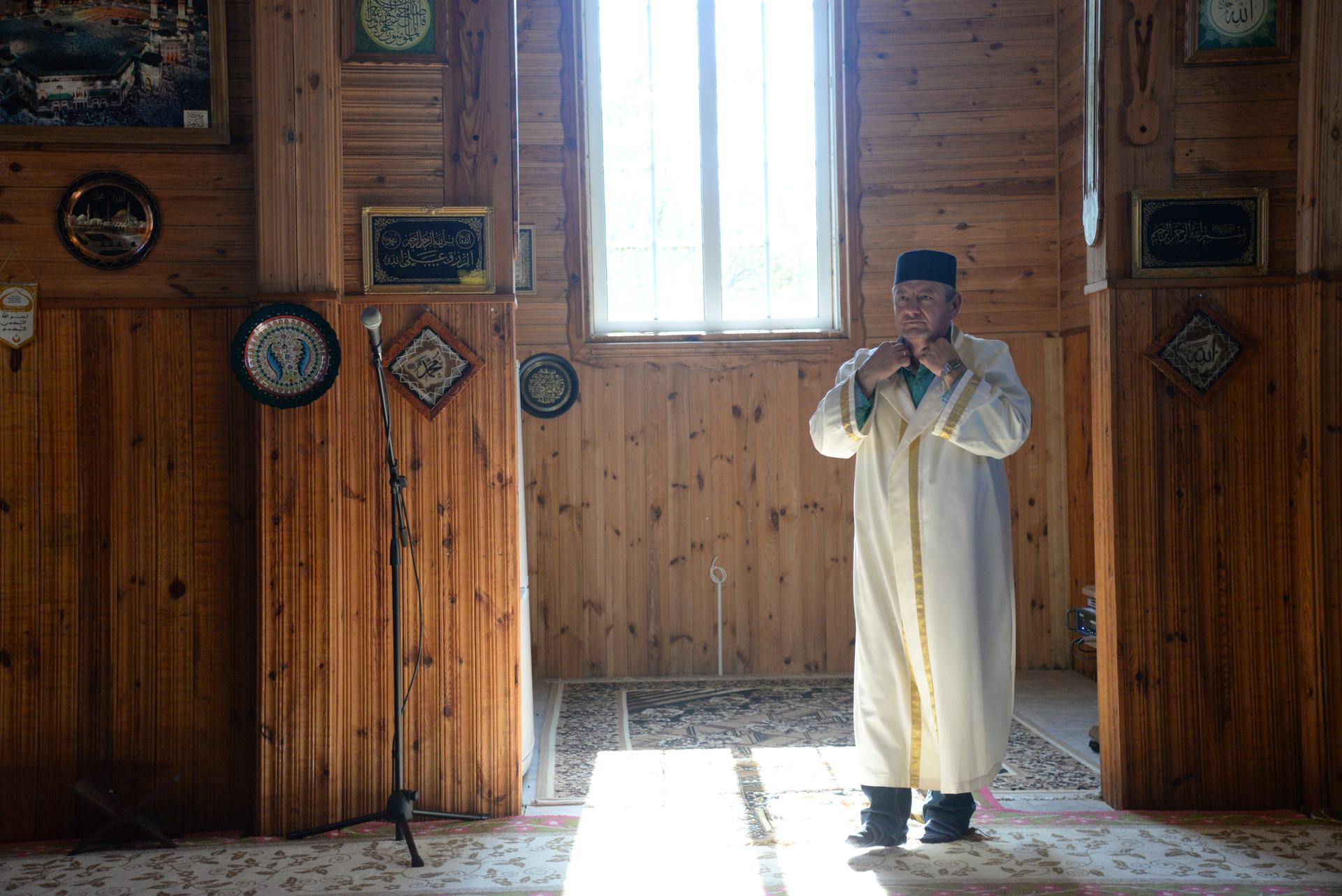 Man in mosque wearing robe