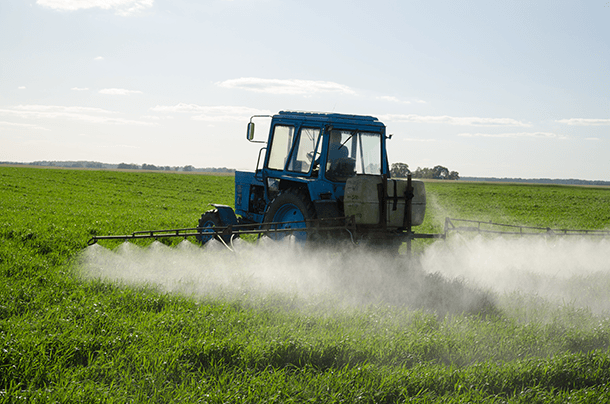 Tractor spraying glyphosate