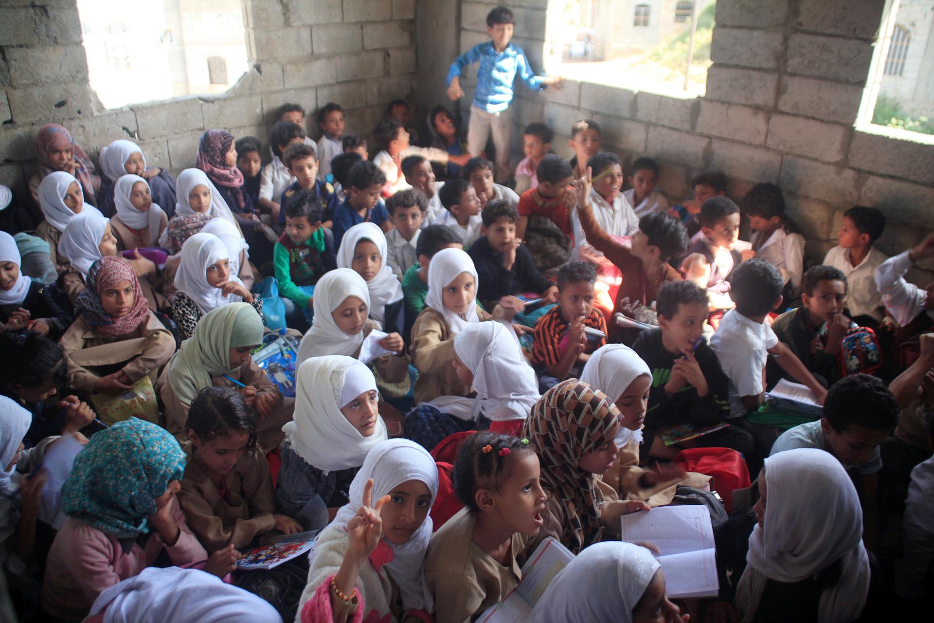 Students attend a class at the teacher's house, who turned it into a makeshift free school that hosts 700 students, in Taiz, Yemen October 18, 2018.