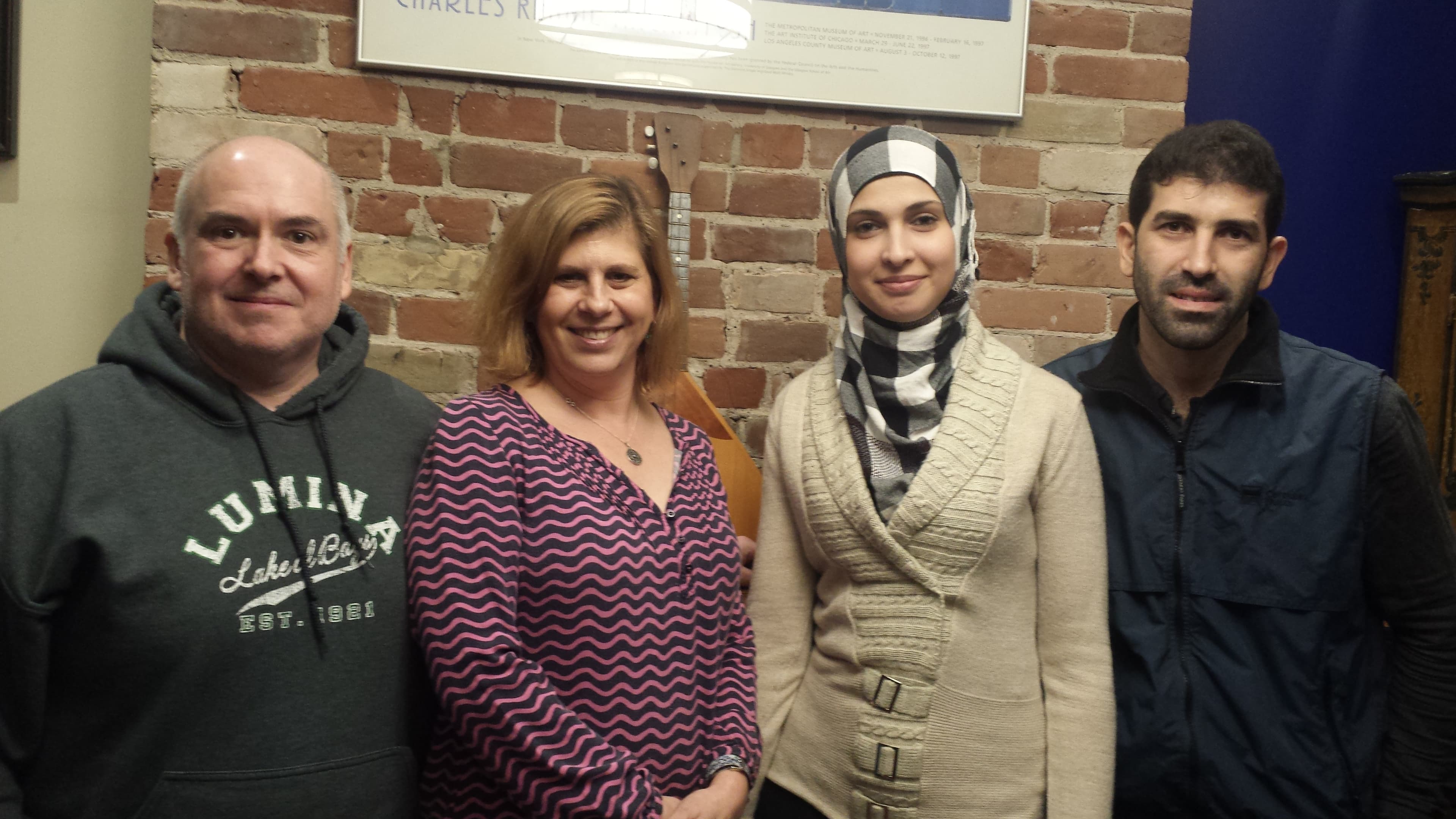 Chris Monahan (far left) and Ashley McCaal (near left) sponsored Ghader Bsmar (near right) and Hamzeh Mourad (far right) after the Syrian family arrived last December.