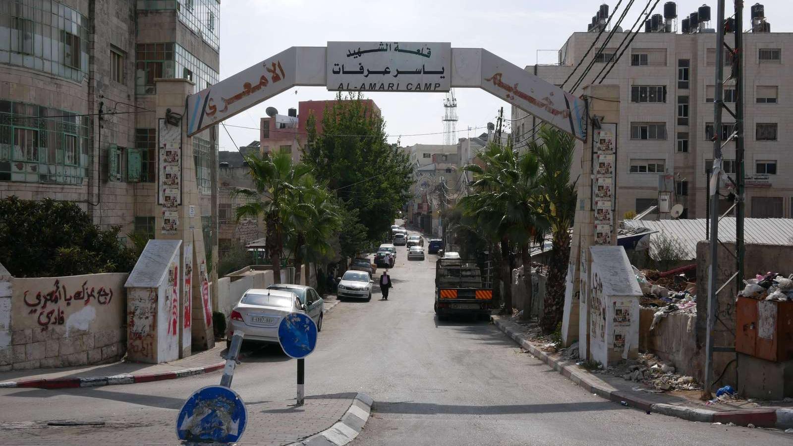 The white gated entrance to the Am'ari camp. 