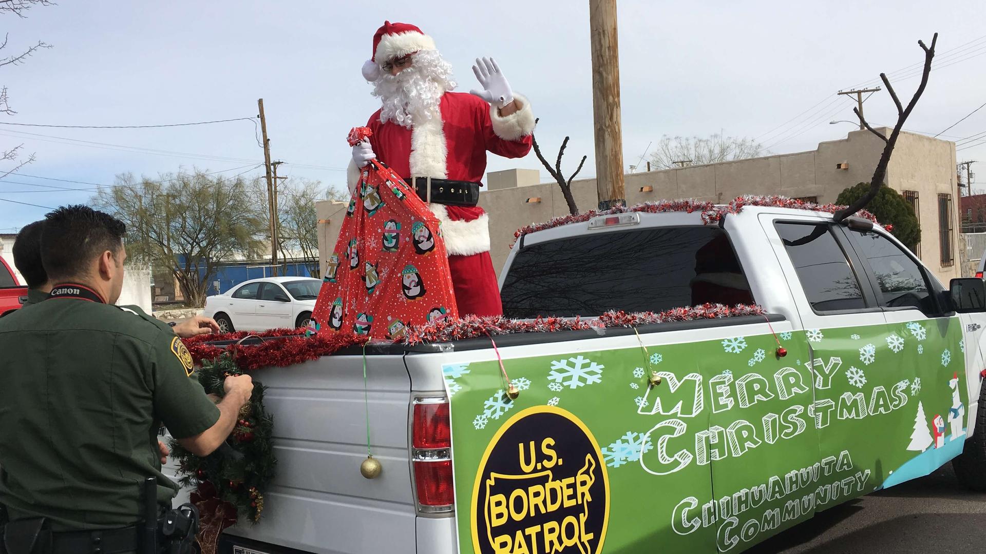 A man wearing a Santa Claus costume arrives in a pickup truck in El Paso, Texas. 