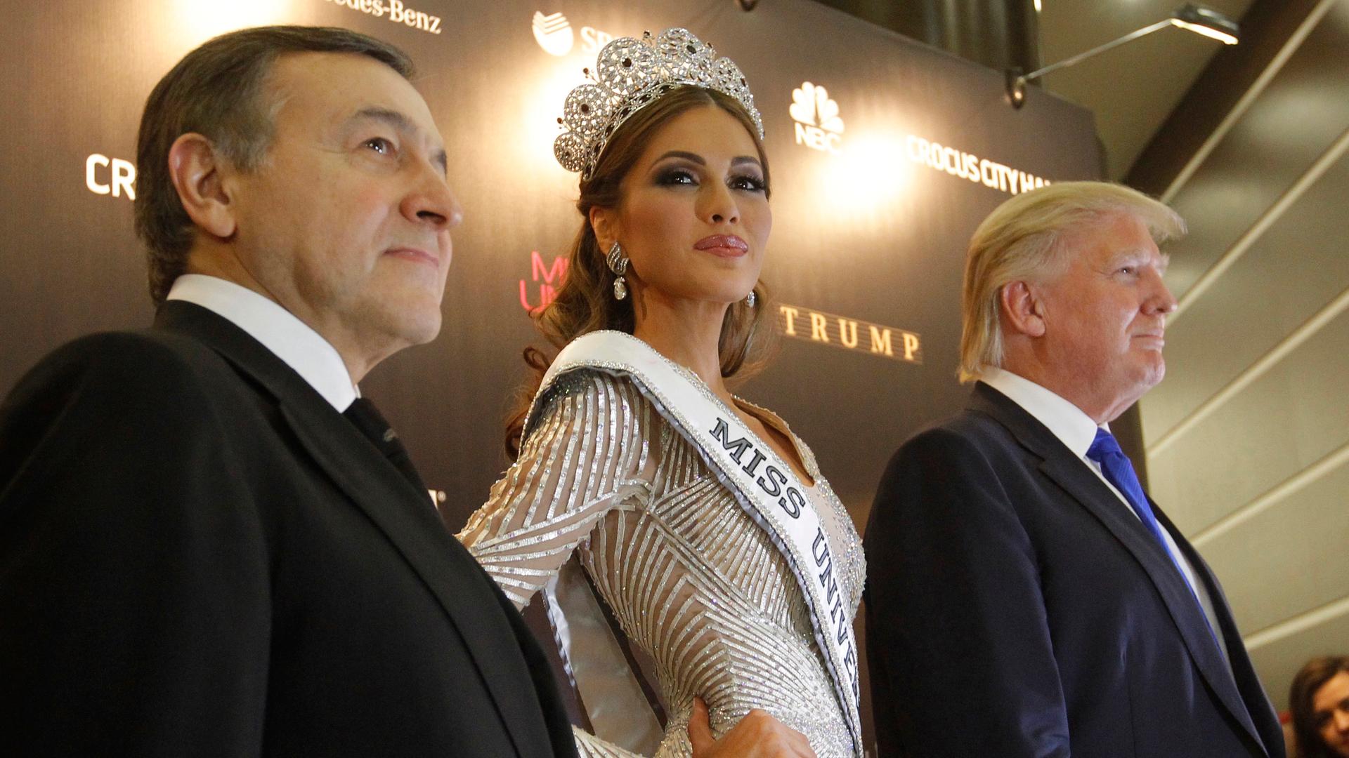Miss Universe 2013 Gabriela Isler stands between Donald Trump, co-owner of the Miss Universe Organization, and Russian oligarch Aras Agalarov, during a news conference following the Miss Universe pageant at Crocus City Hall in Moscow on November 9, 2013.