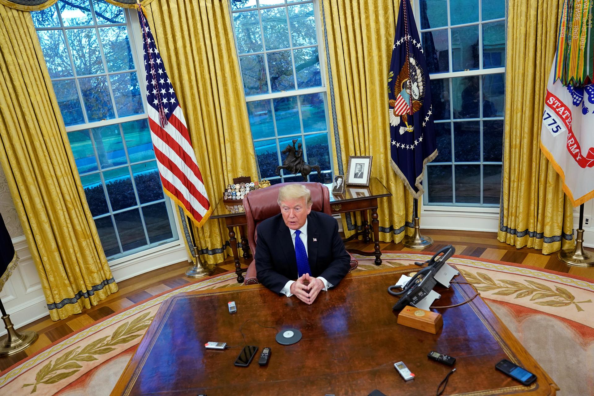 President Donald Trump answers questions during an exclusive interview with Reuters journalists in the Oval Office at the White House in Washington,  DC on December 11, 2018. Asked about his past business connections with Russia, Trump said, "The stuff yo