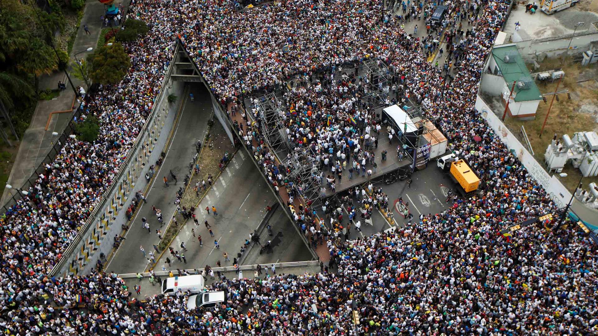 Thousands of people crowd roads in this overhead image of the opposition rally in Caracas