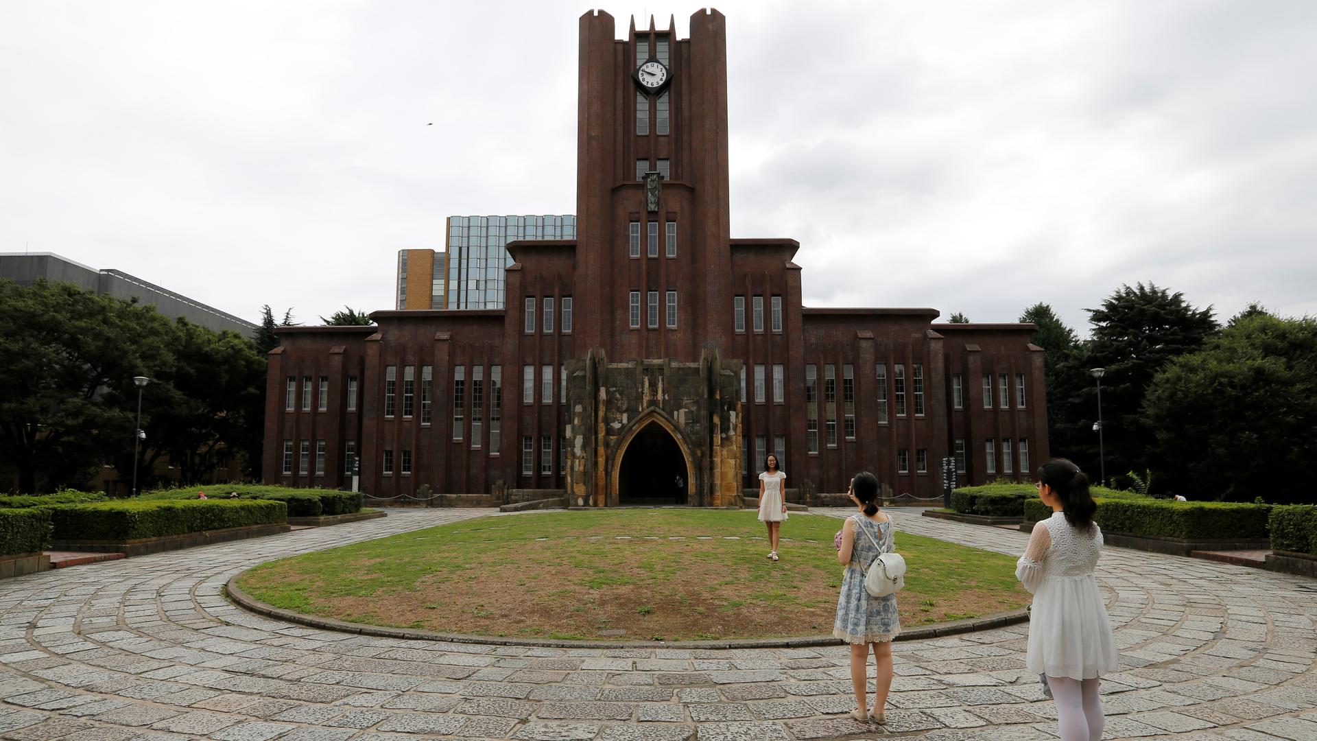 two students stand outside the Yasuda auditorium at the University of Tokyo