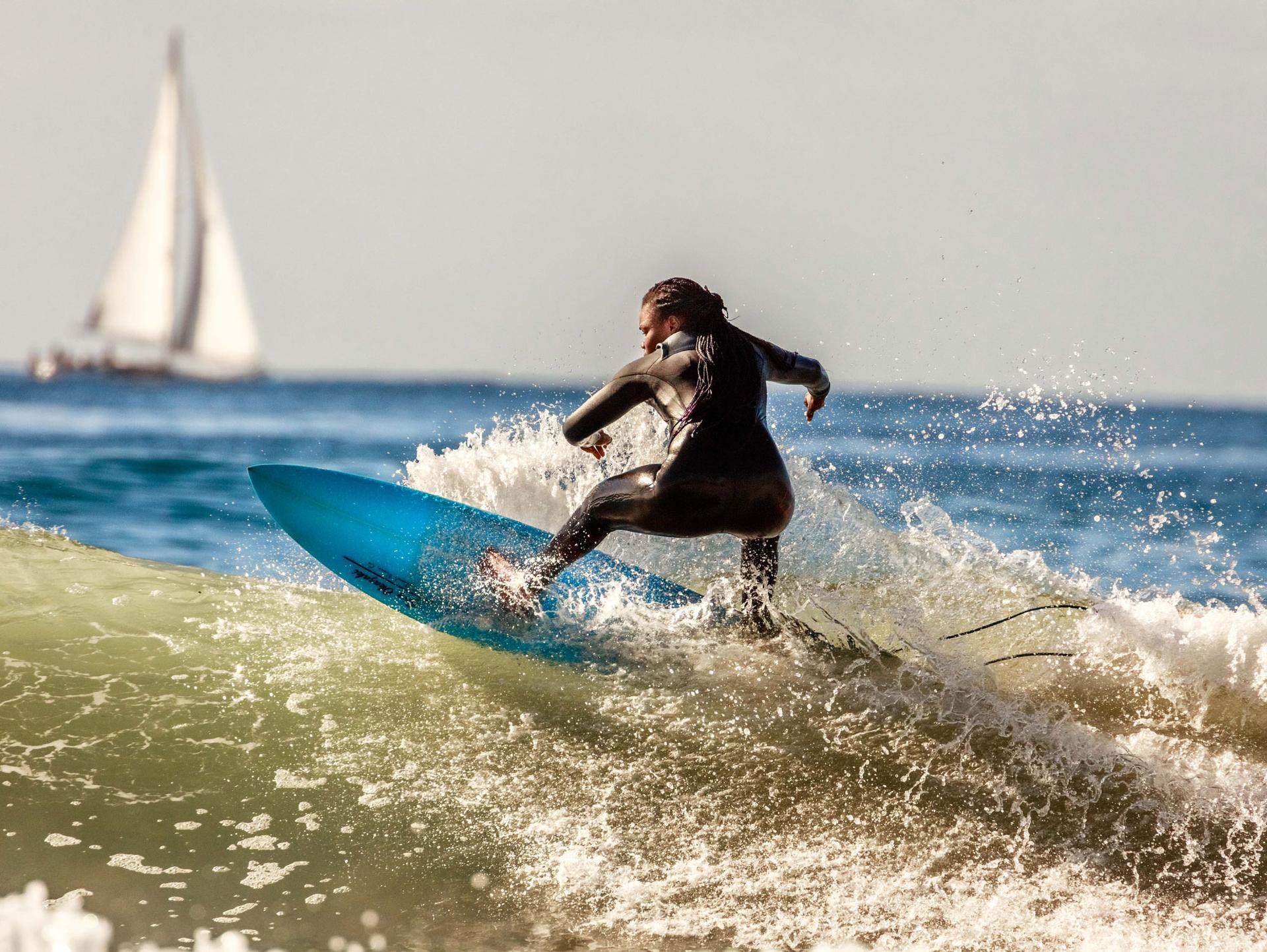 A woman riding a wave