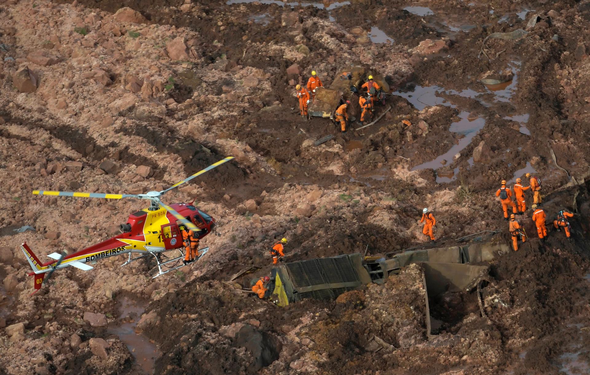 an aerial view of the red mud covering everything after the dam collapsed 