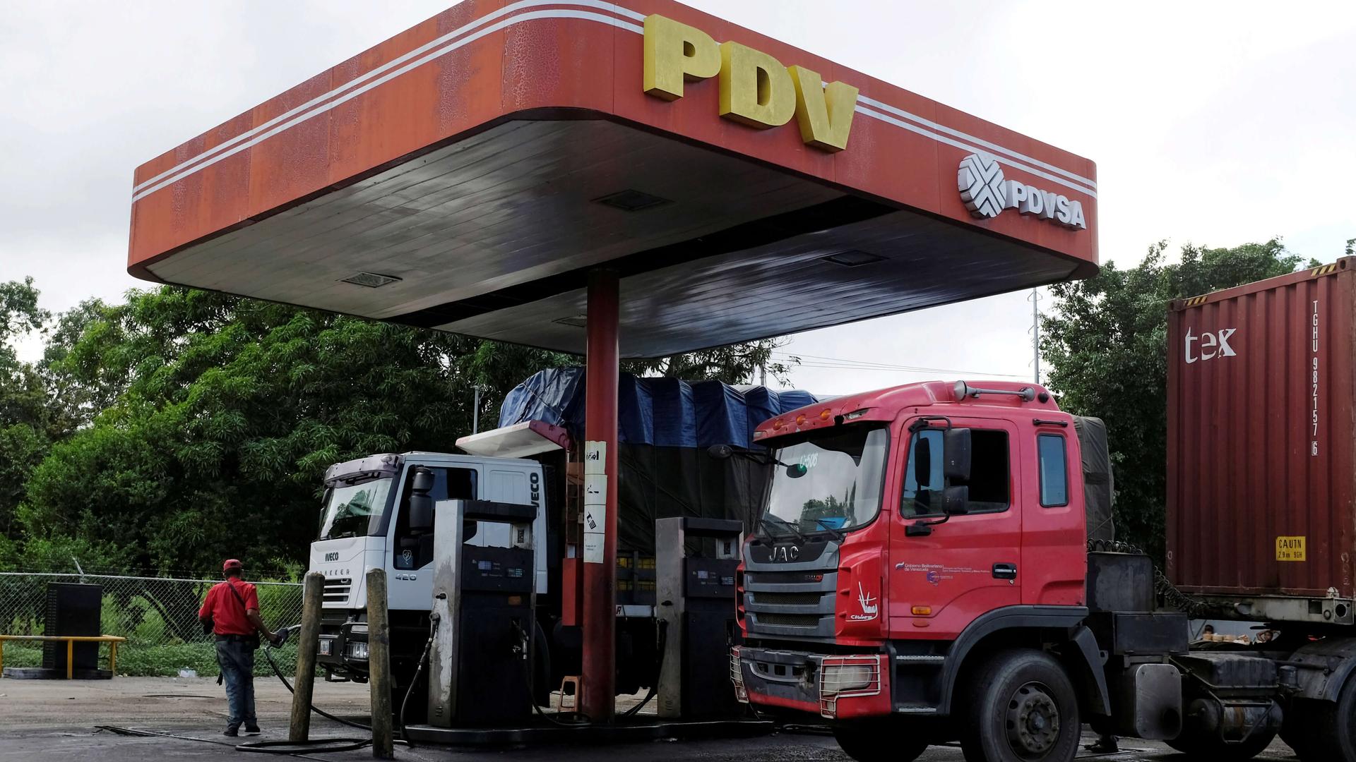 The corporate logo of Venezuelan state-owned oil company PDVSA is seen at a gas station sign