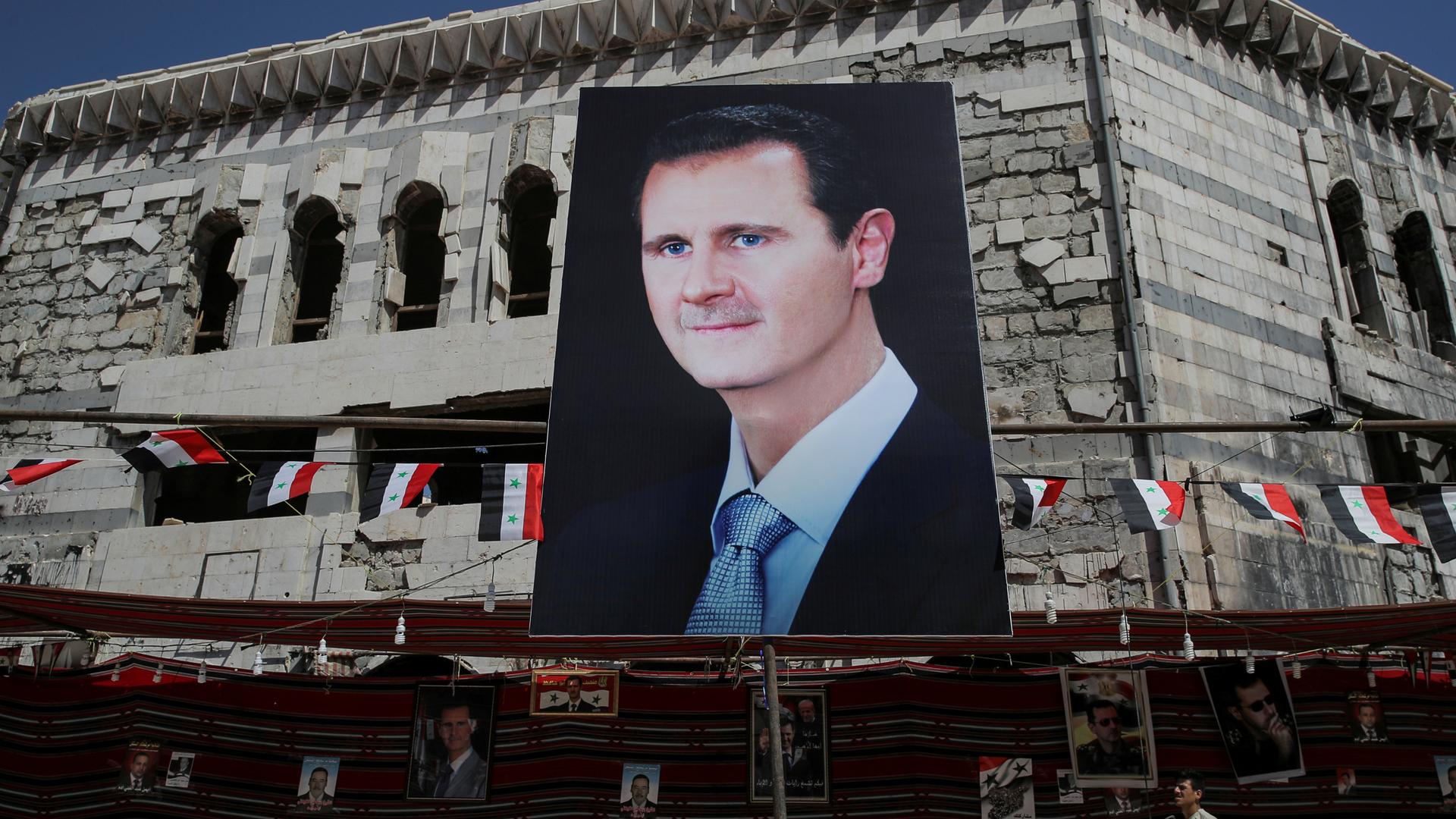 A huge banner of Bashar al-Assad.