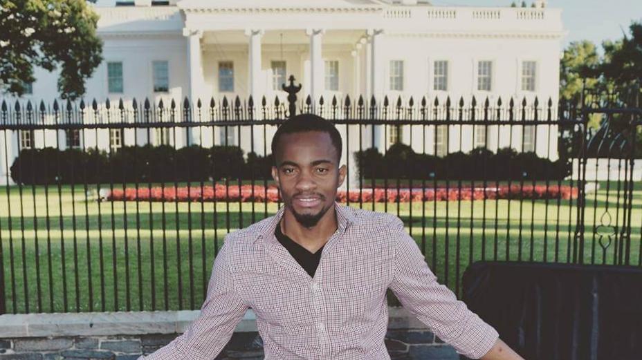 Alex Bukasa, a Congolese asylum-seeker and former journalist, poses in front of the White House. 