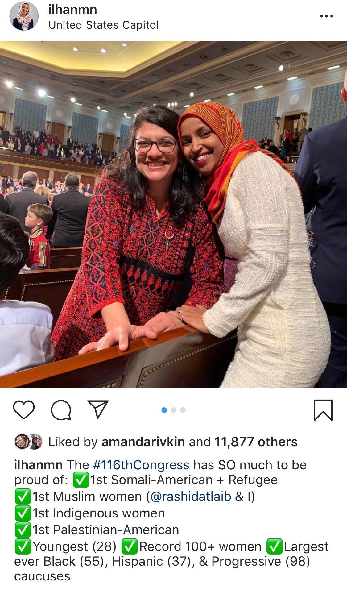 Reps. Rashida Tlaib and Ilhan Omar pose on the House floor at their swearing-in