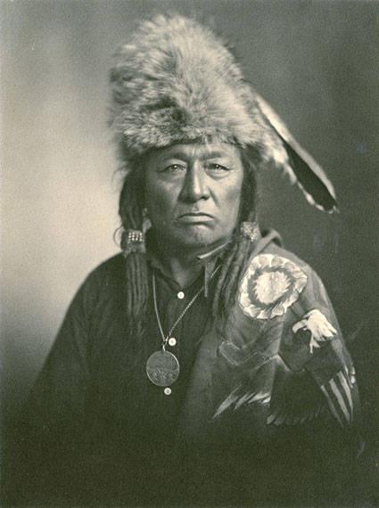 An Indigenous Cree chief sits for a portrait