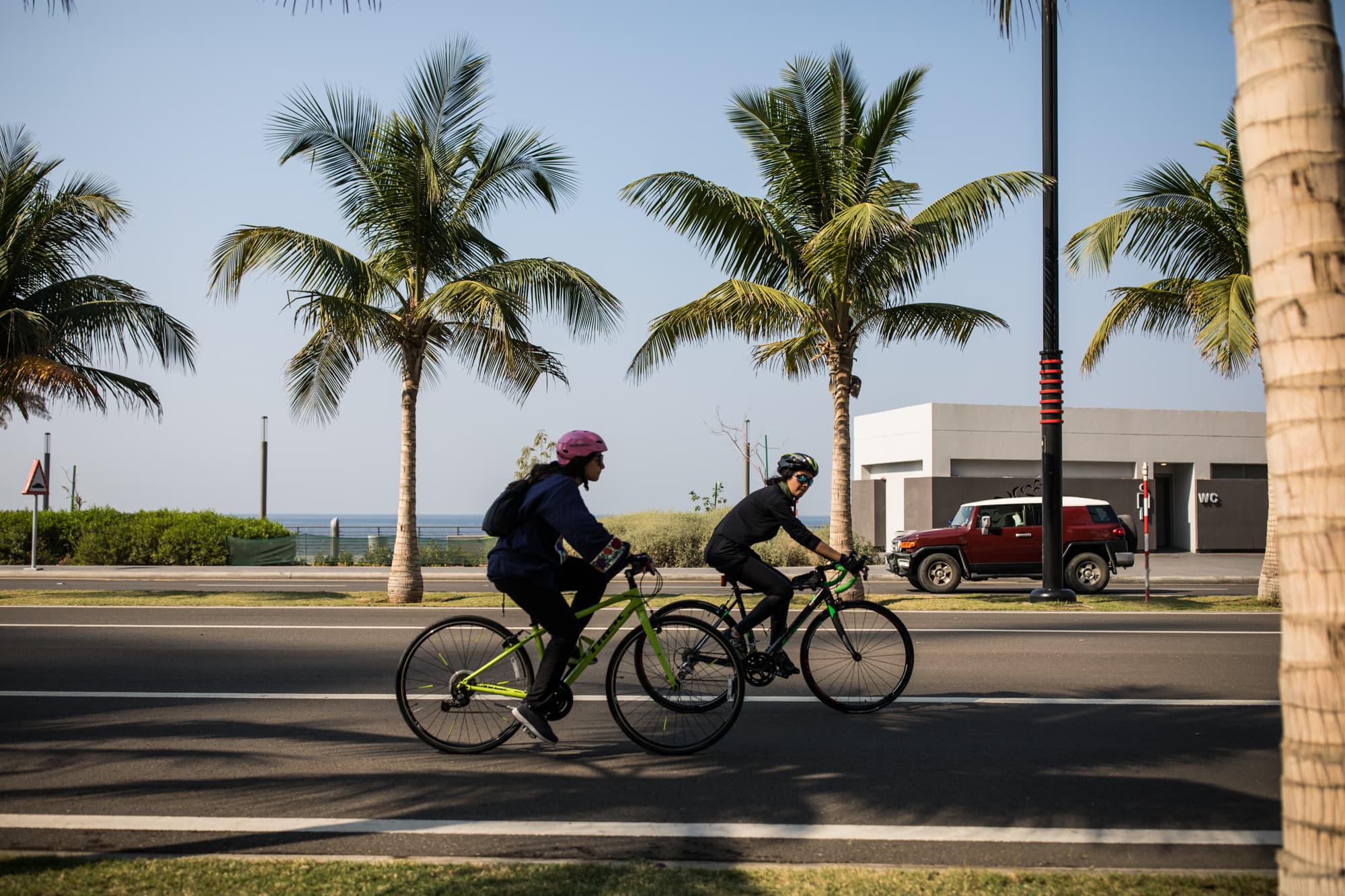 Doaa Naeem and her sister Fatimah Naeem ride their bikes in Jeddah, Saudi Arabia.
