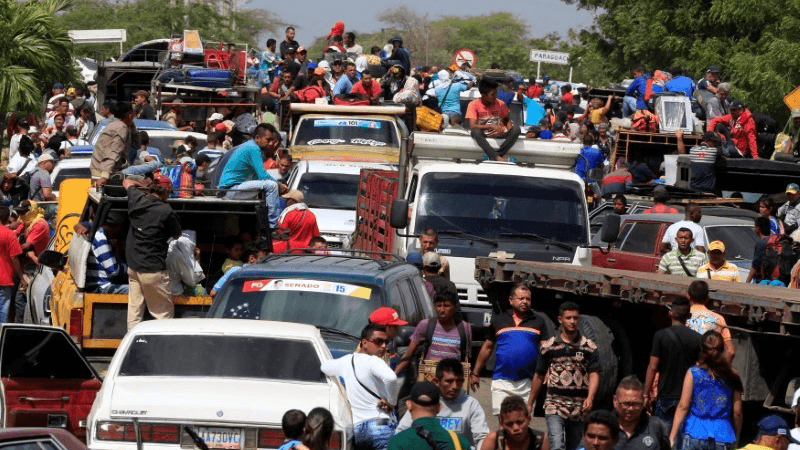 Venezuelans line up to cross into Colombia at the border in Paraguachón, Colombia, Feb. 16, 2018.