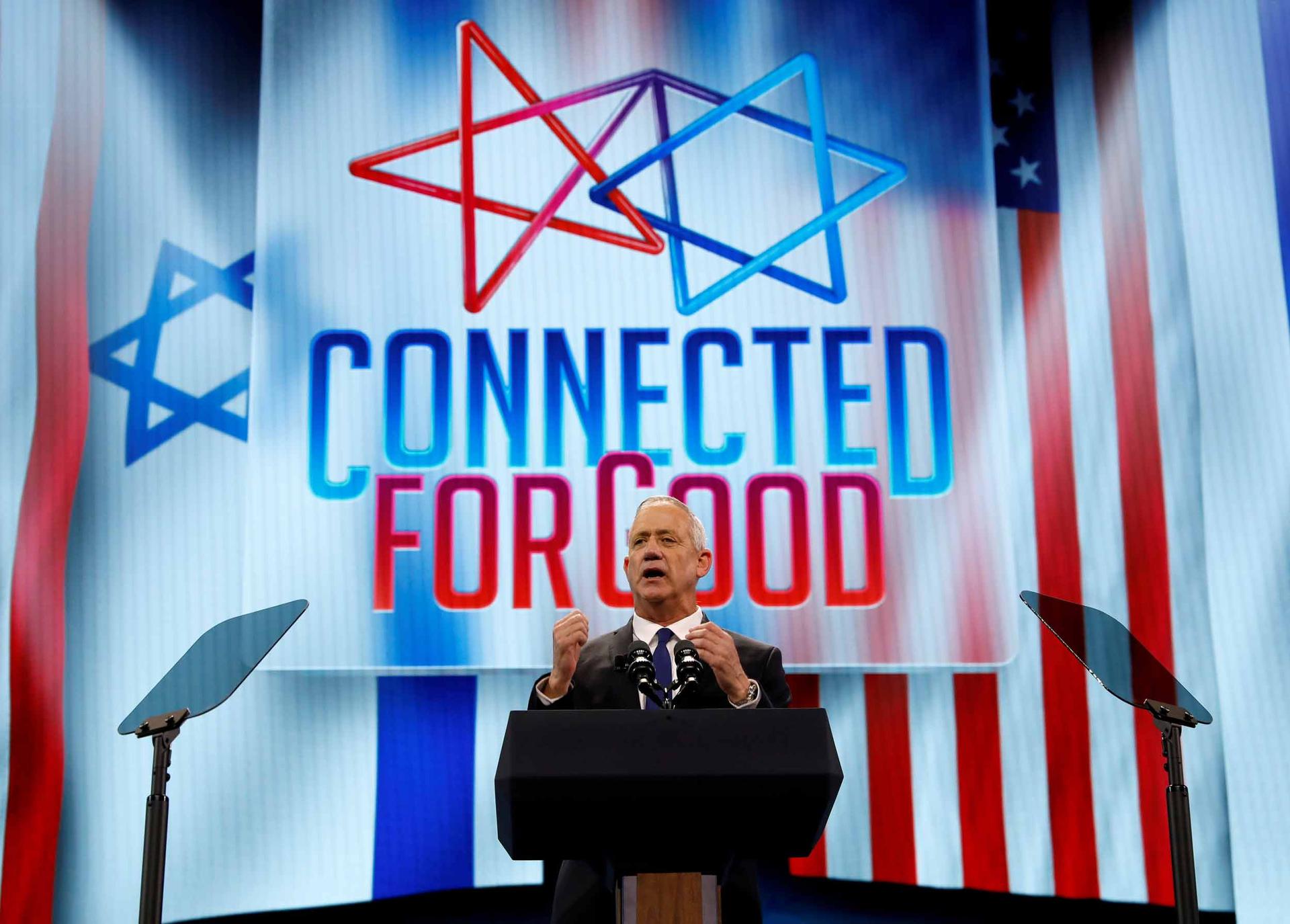 Israel's Blue and White party leader Benny Gantz speaks at AIPAC in Washington, DC, on March 25, 2019. The screen behind him says 