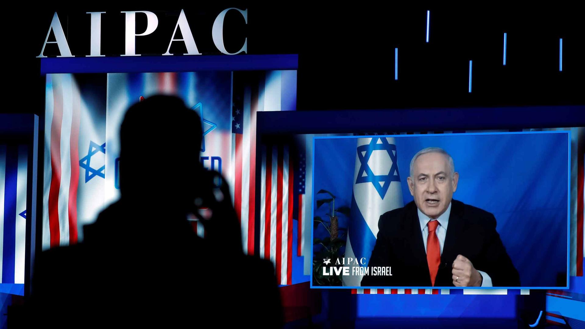 Benjamin Netanyahu speaks to a conference via video chat
