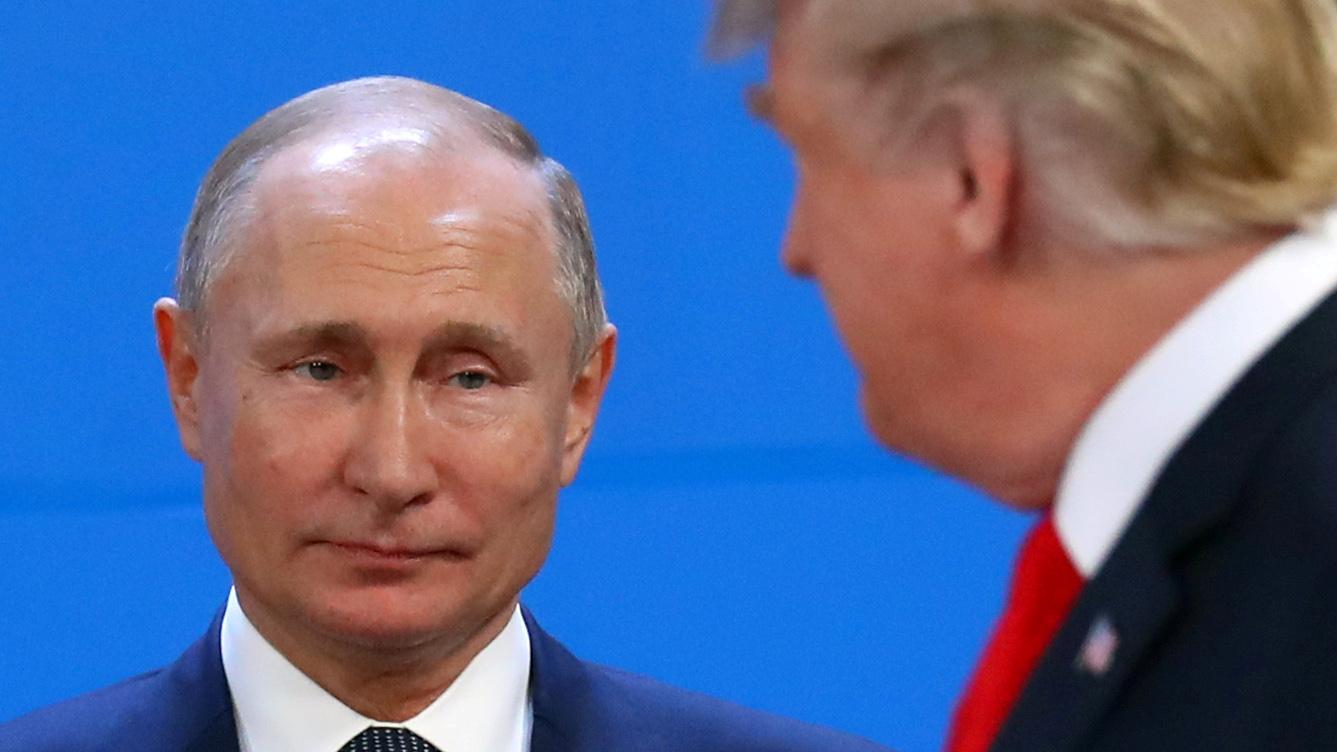 A close up of Putin looking at Trump 