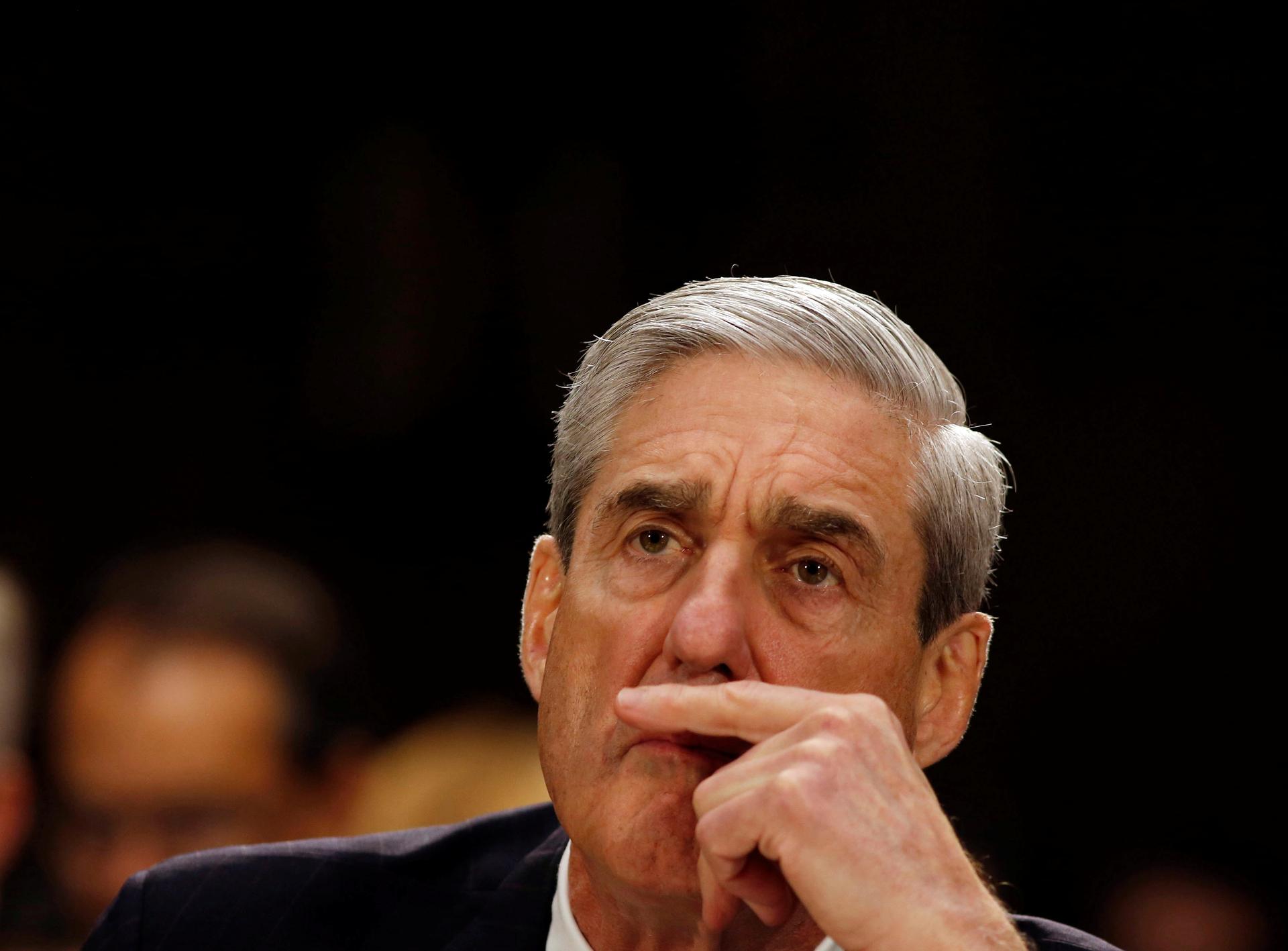 Mueller has a pensive face. 