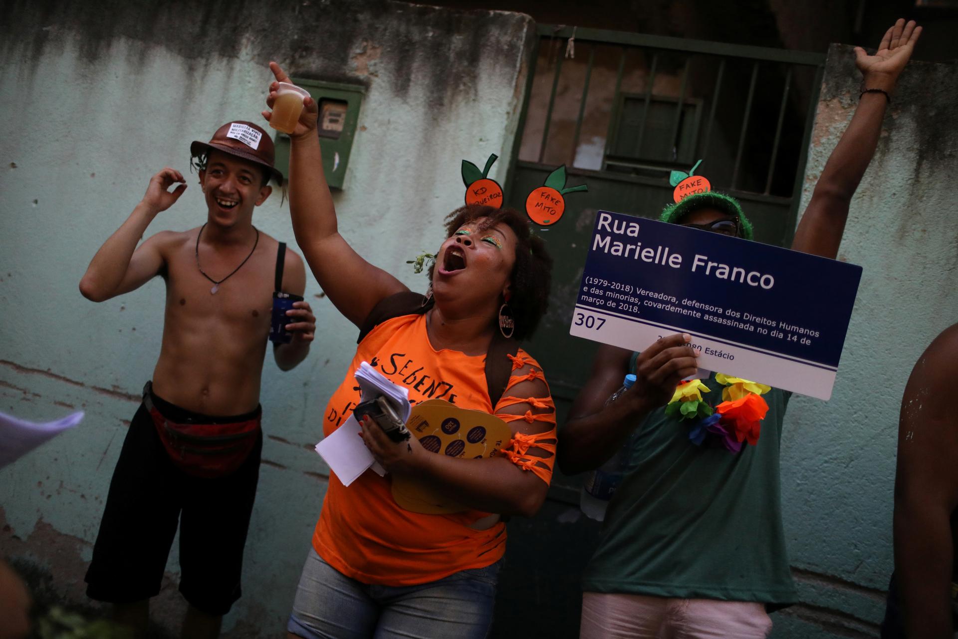 street protester in brazil dresses as orange during carnival