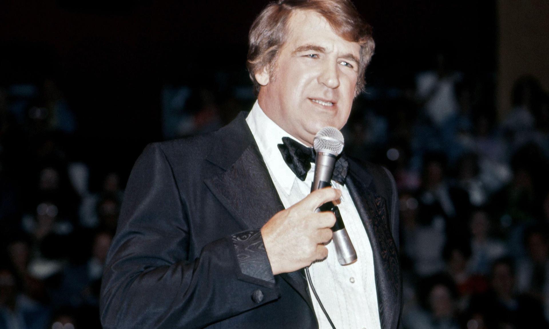 Comedian Shecky Greene performs in 1976.