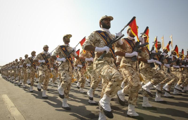 A block of soldiers marches in uniform