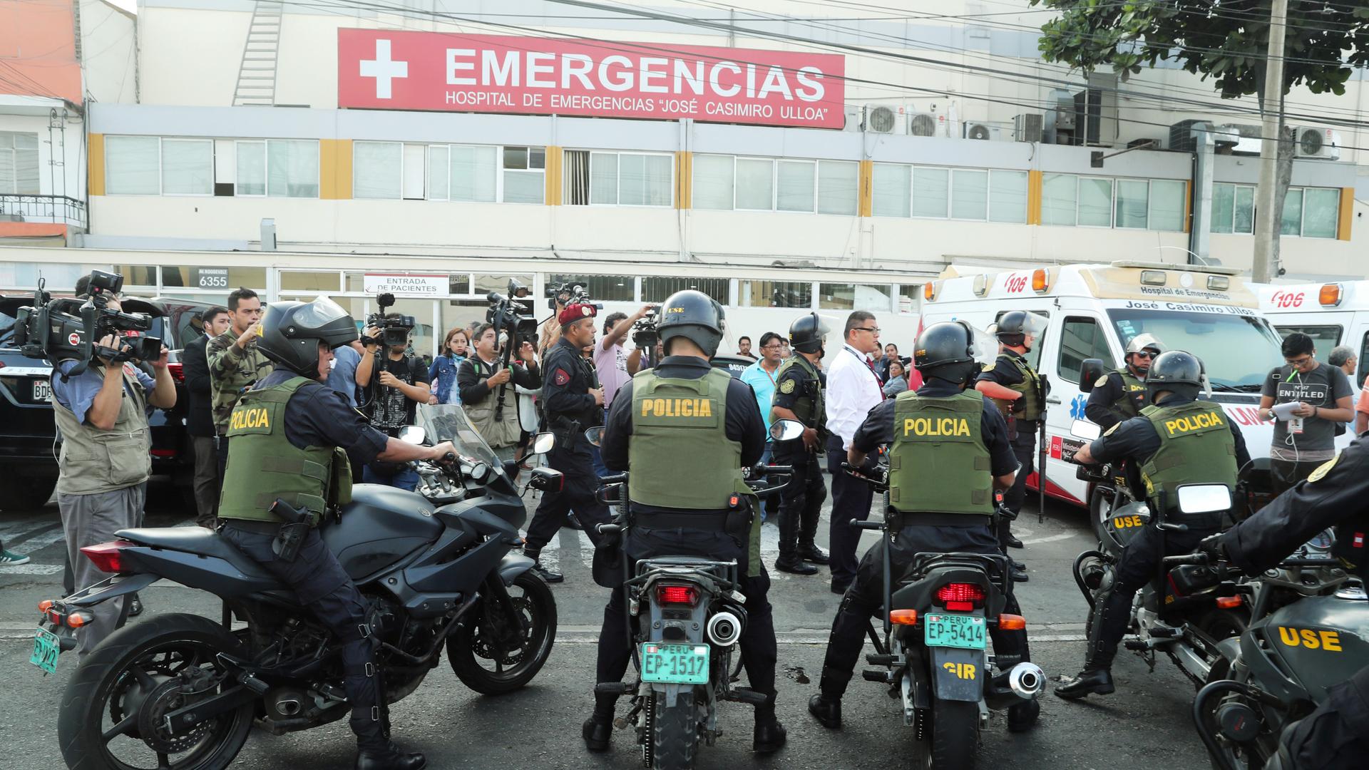 outside a hospital in peru, many police