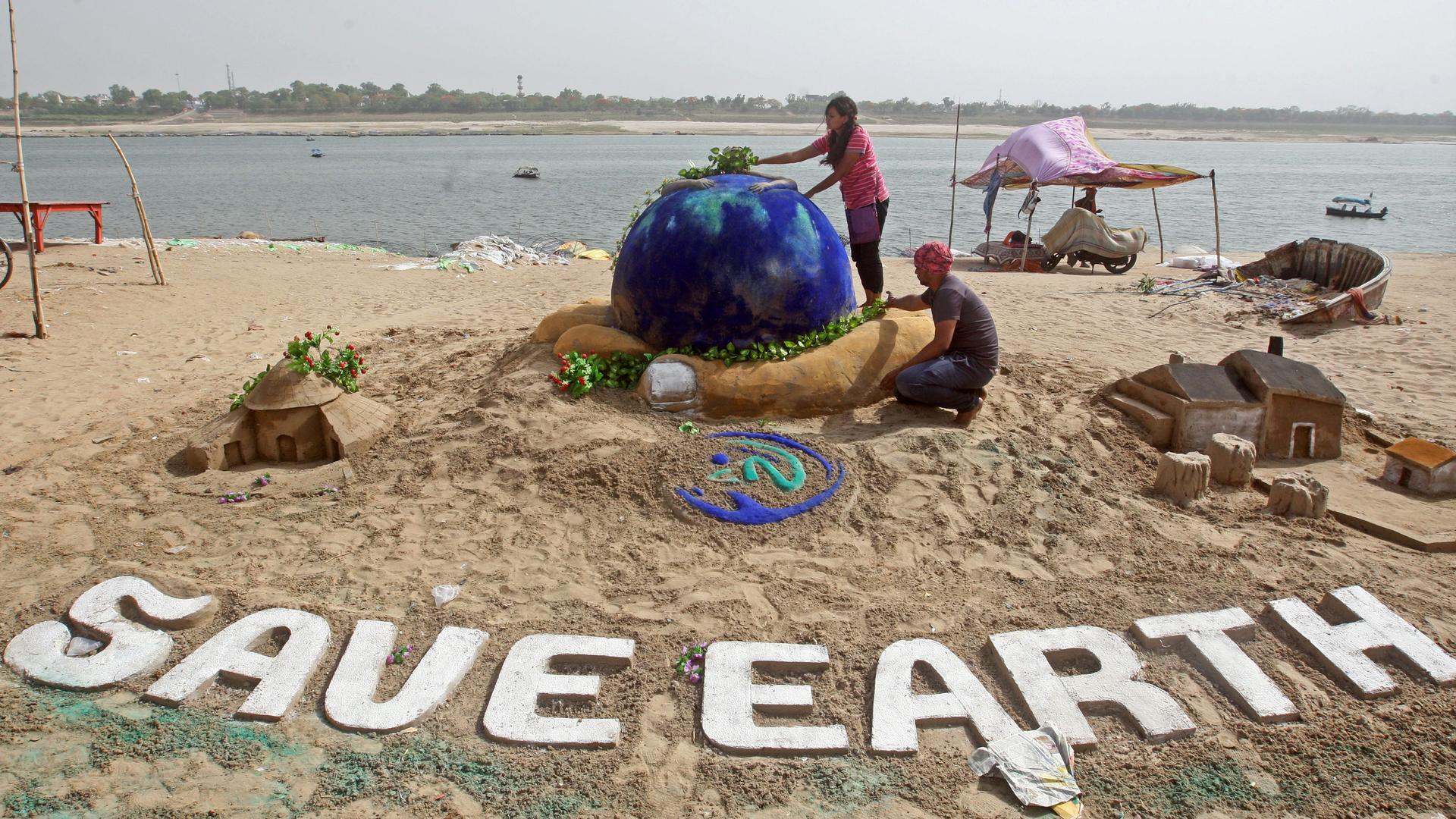 children on a beach on earth day