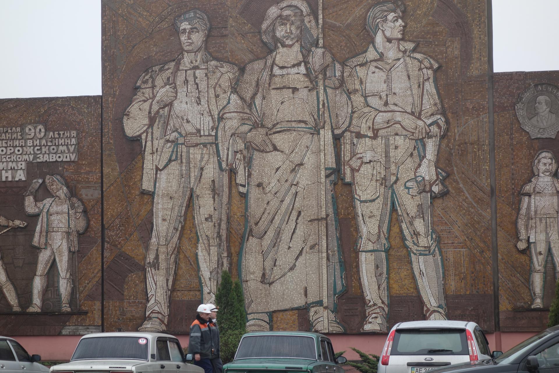 Mosaic of Soviet design in front of mining company entrance.