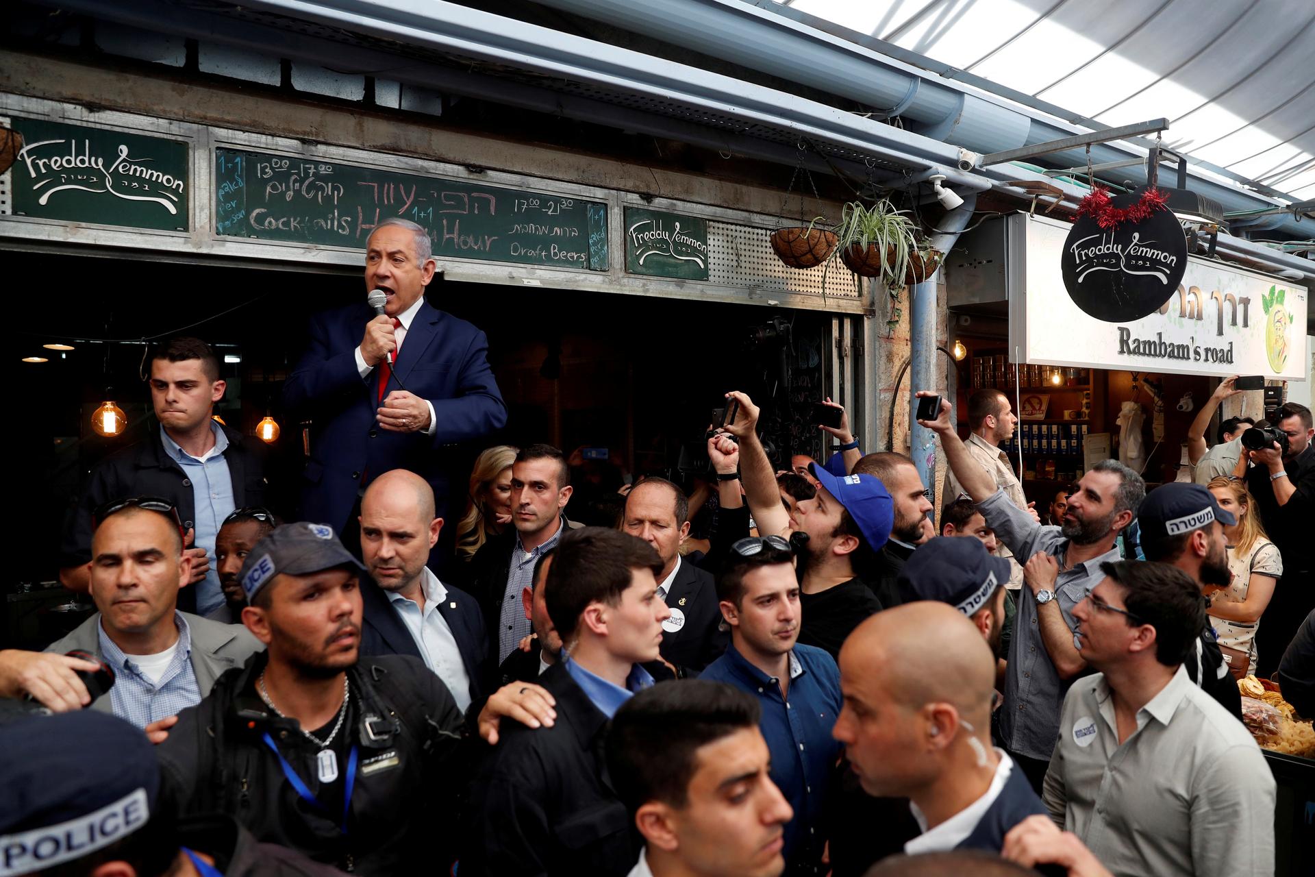 Israeli Prime Minister Benjamin Netanyahu speaks to a crowd during a visit to the Mahane Yehuda Market in Jerusalem one day ahead of Israeli national elections on April 8, 2019. 