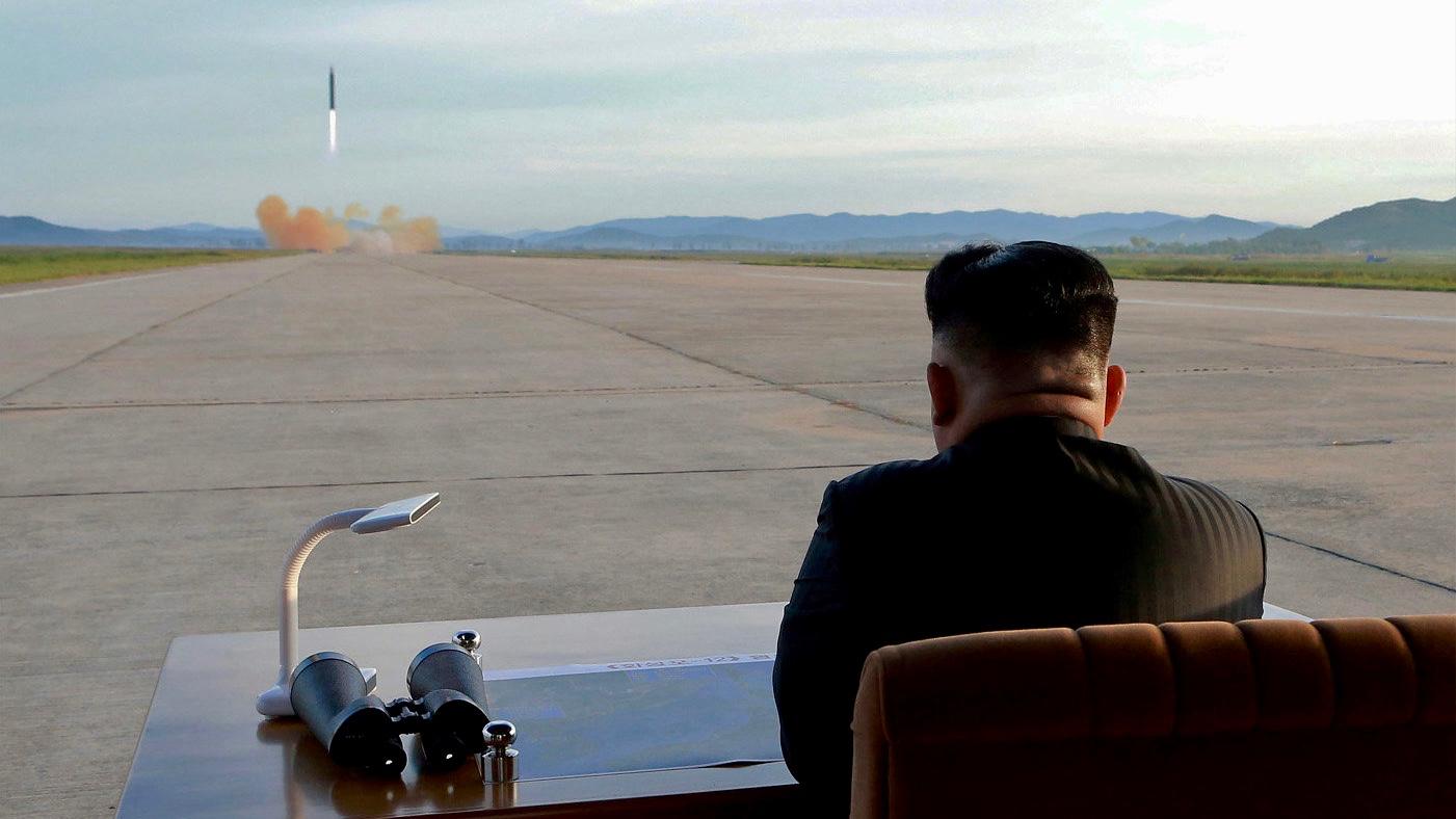 North Korean leader Kim Jong-un watches the launch of a Hwasong-12 missile in this undated photo released on September 16, 2017 by the Korean Central News Agency.