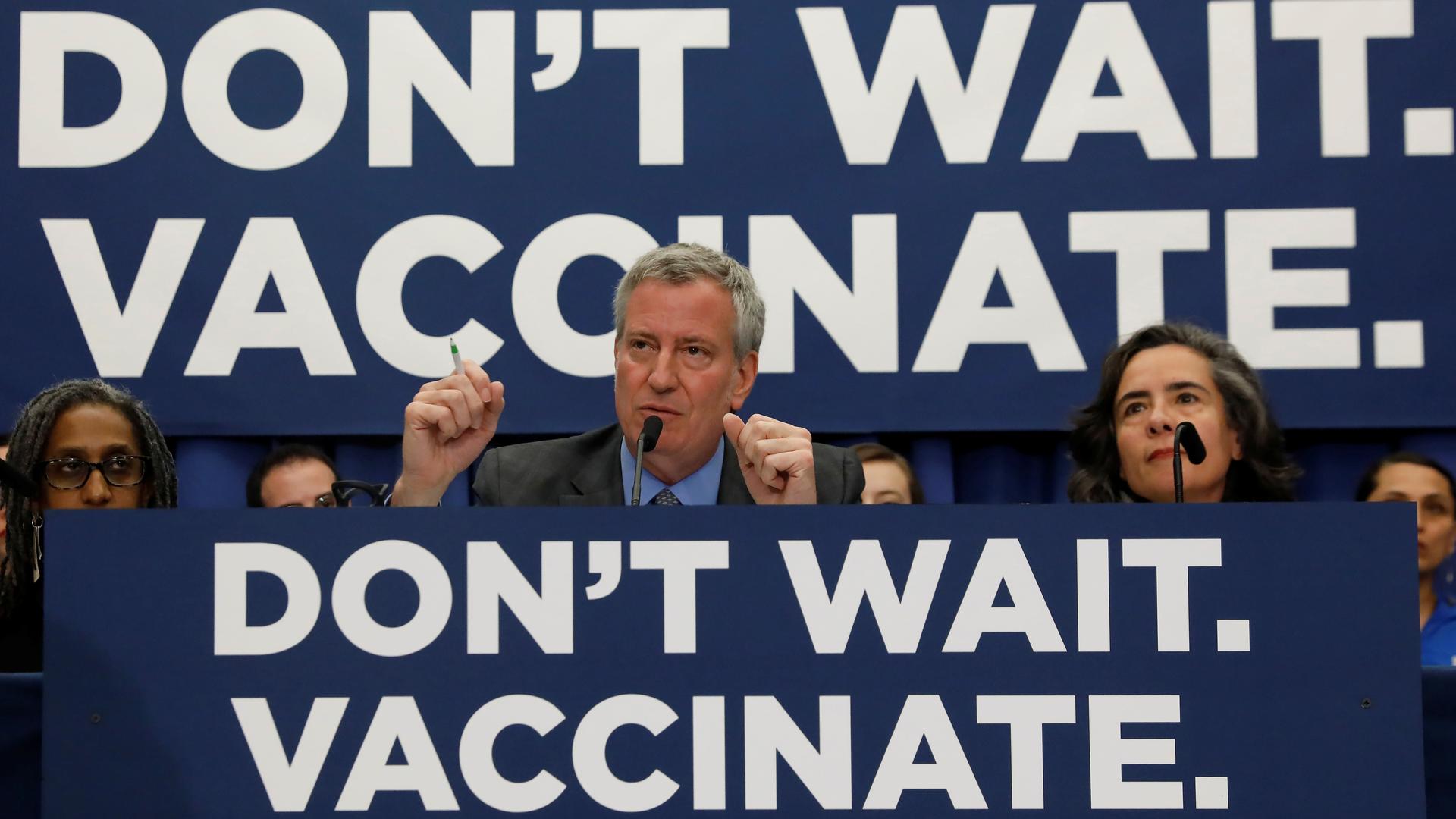 don't wait, vaccinate signs