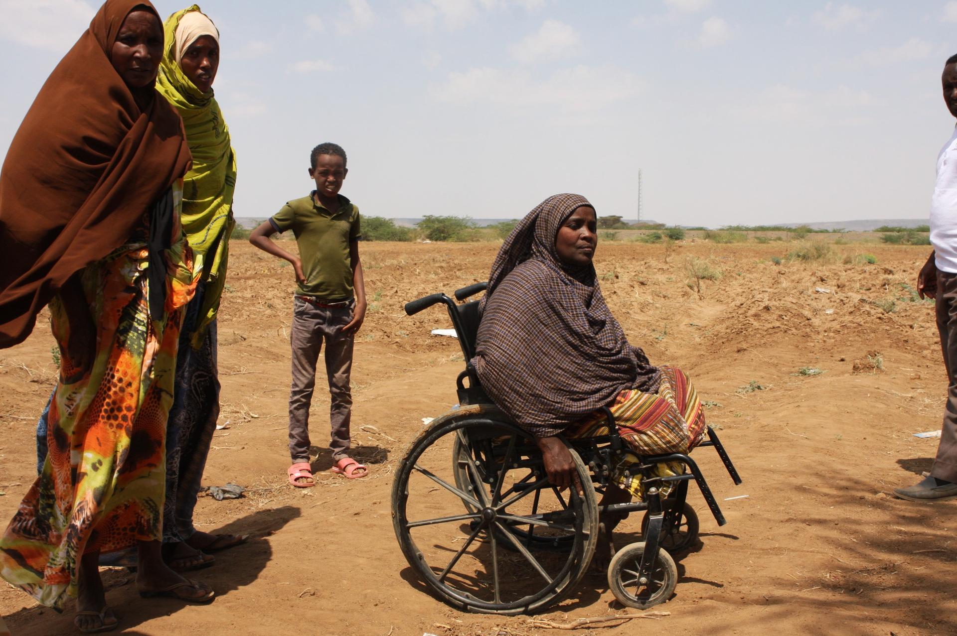 This Somali woman, seated in a wheelchair, at a camp outside Dire Dawa says she escaped violence at her village in the Oromia region by being carried out on a stretcher while pretending to be dead.