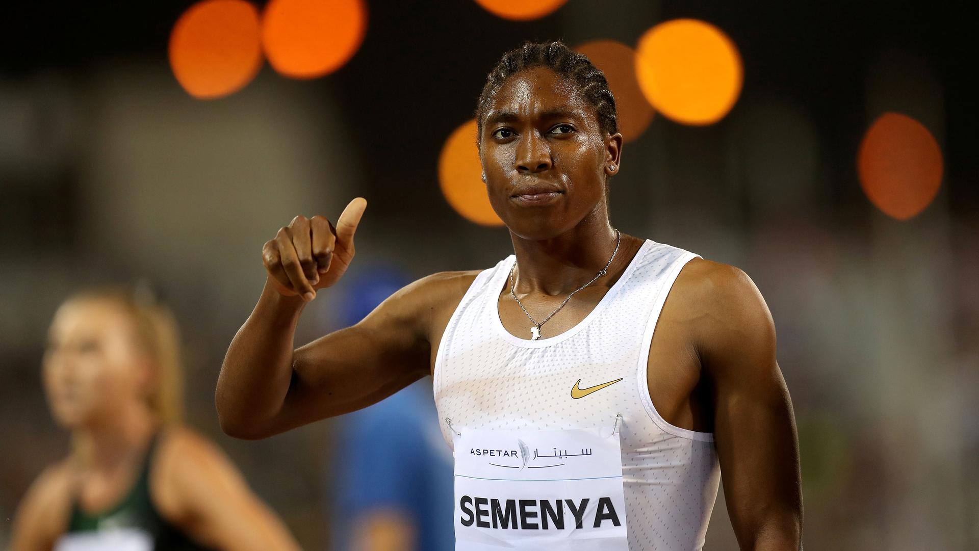 South Africa's Caster Semenya is shown wearing a white running singlet and a bib with "Semenya" printed on it.