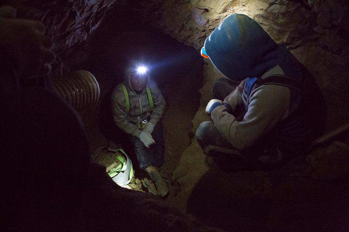 Three miners use hand tools to dig for gold 70 feet down a mineshaft north of Ulaanbaatar. They’re part of a small-scale mining cooperative that’s chosen not to use toxic mercury in their gold processing.
