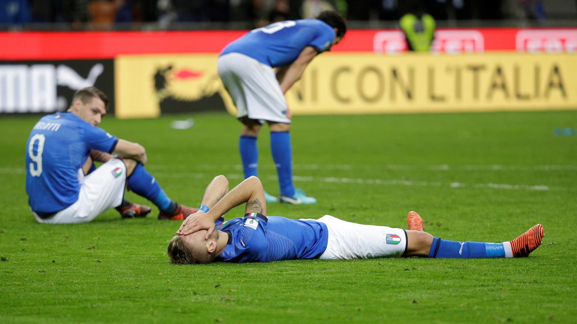Italy players look dejected after their game with Sweden in a qualifying match for the 2018 FIFA World Cup in Russia