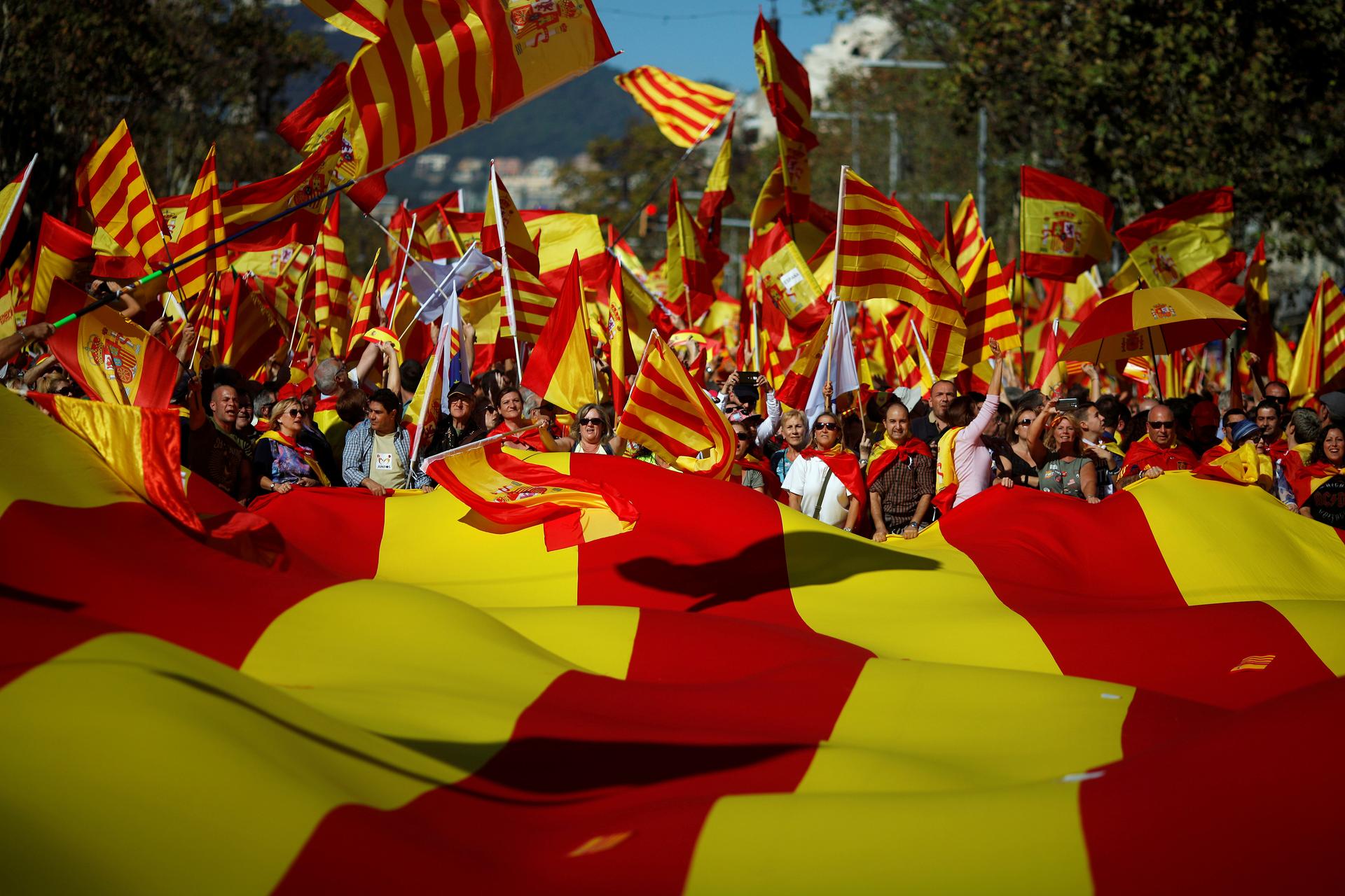 Pro-unity supporters take part in a demonstration in central Barcelona