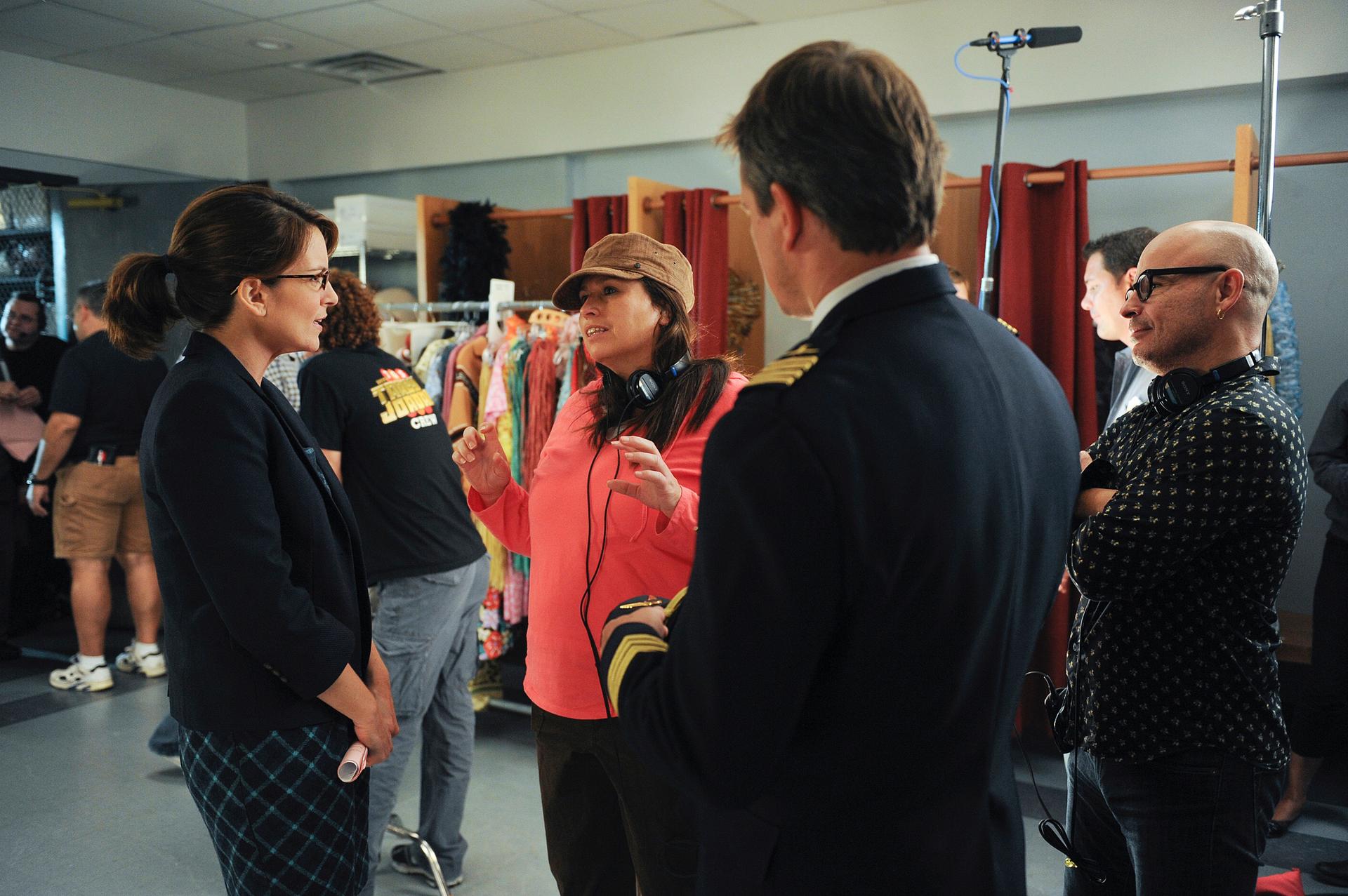 Beth McCarthy-Miller (center) on the set of “30 Rock” with Tina Fey (left) and guest star Matt Damon (right).