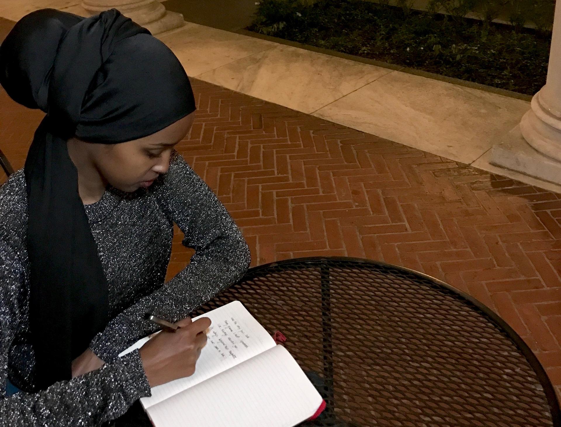 Amal Hussein writes poetry for her performance