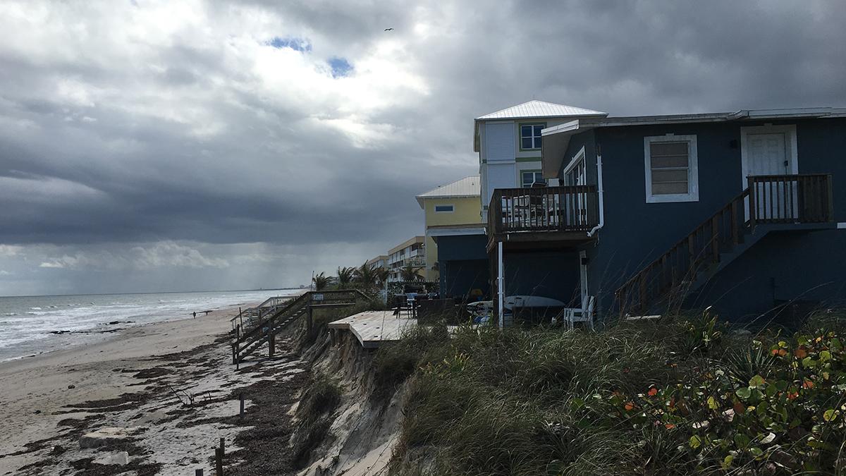Houses in this Florida neighborhood are perched at the edge of a rapidly-eroding part of the town of Satellite Beach. The town is one of the few in the state that's investing in a major plan to shore itself up against the rising seas and stronger storms b