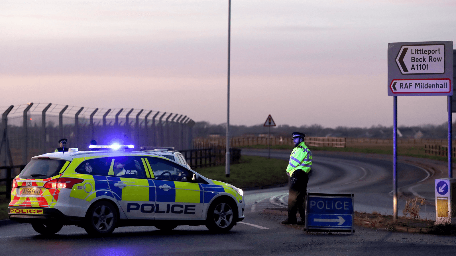British police stand guard at the entrance to the US Air Force base at RAF Mildenhall, Suffolk, Britain, Dec. 18, 2017.