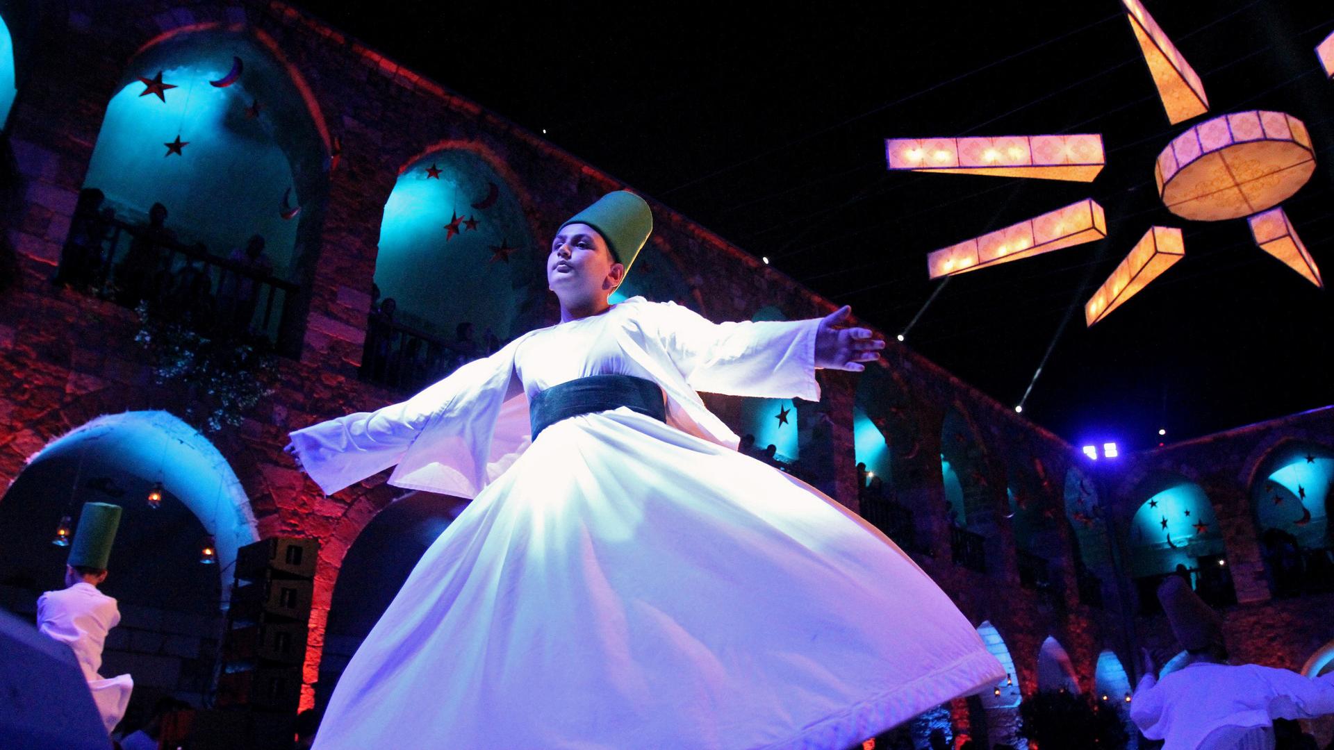 A Sufi dancer celebrating the holy month of Ramadan in Tripoli, Lebanon June 9, 2017.  